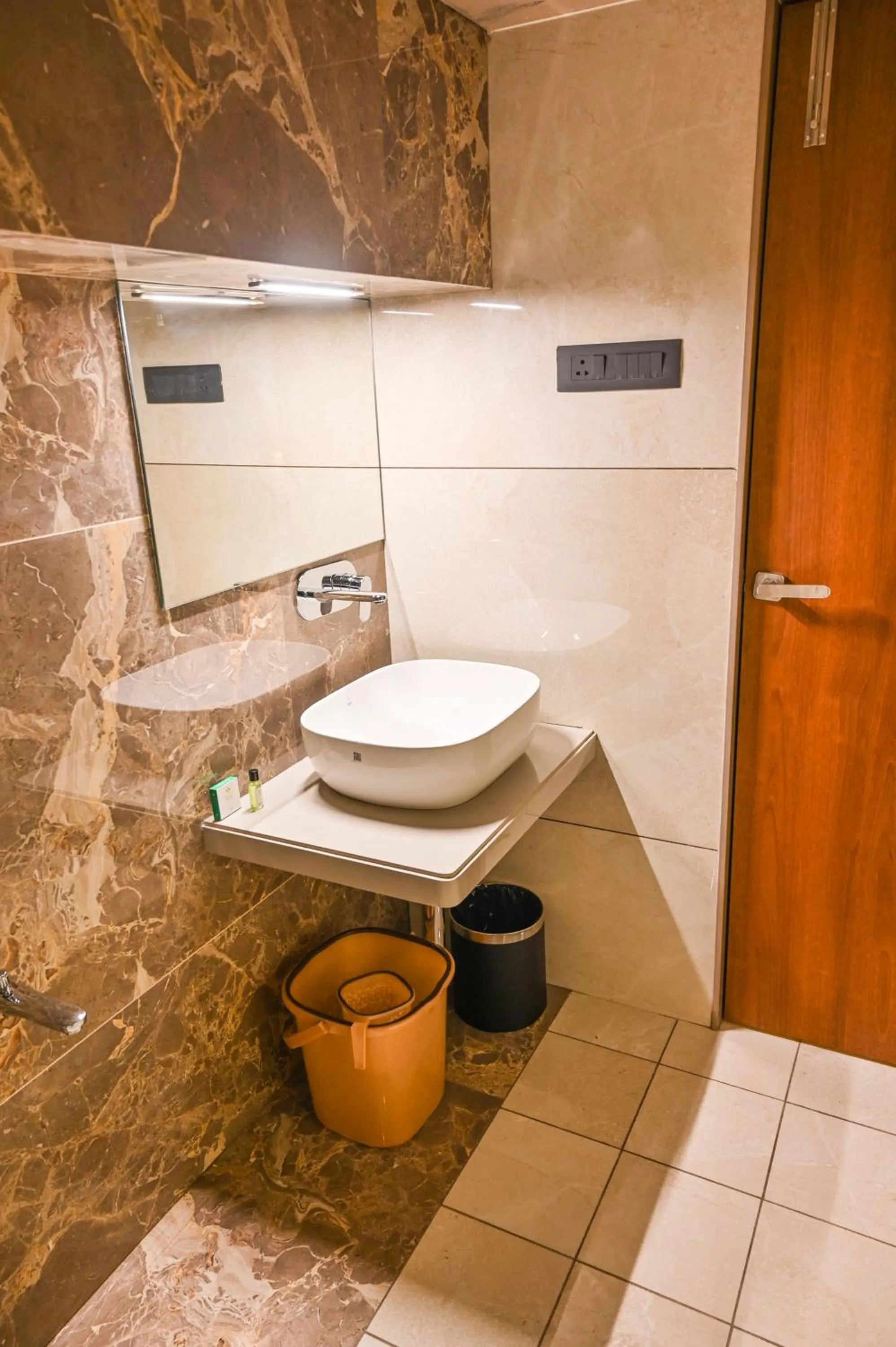 Bathroom in Suvidha Suites