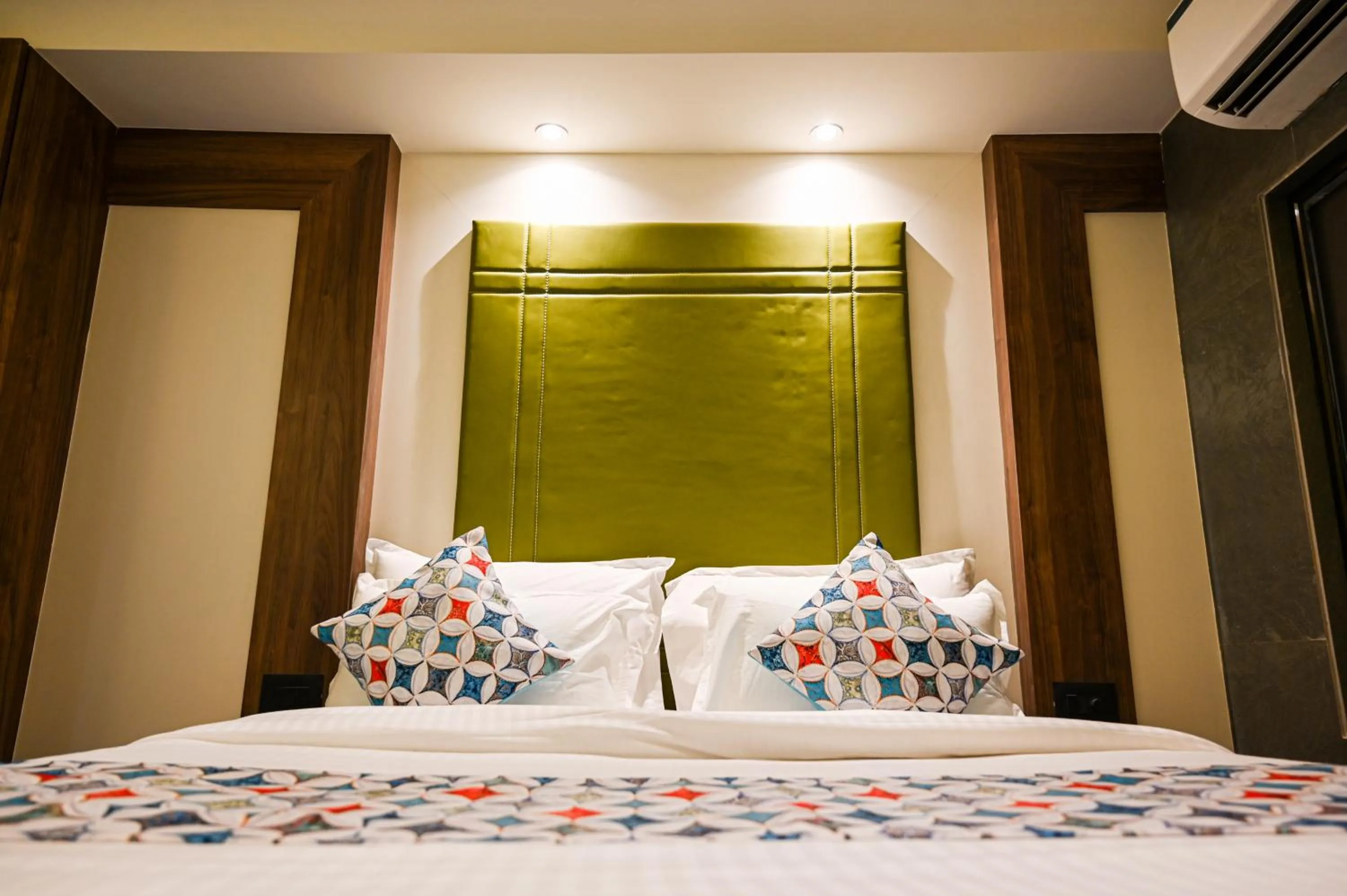 Bed in Suvidha Suites