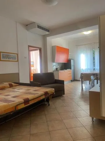 Kitchen or kitchenette, Bed in Aparthotel Gioia