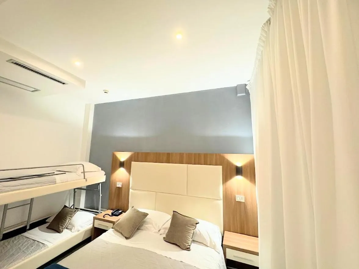 Photo of the whole room, Bed in Aura Living Hotel