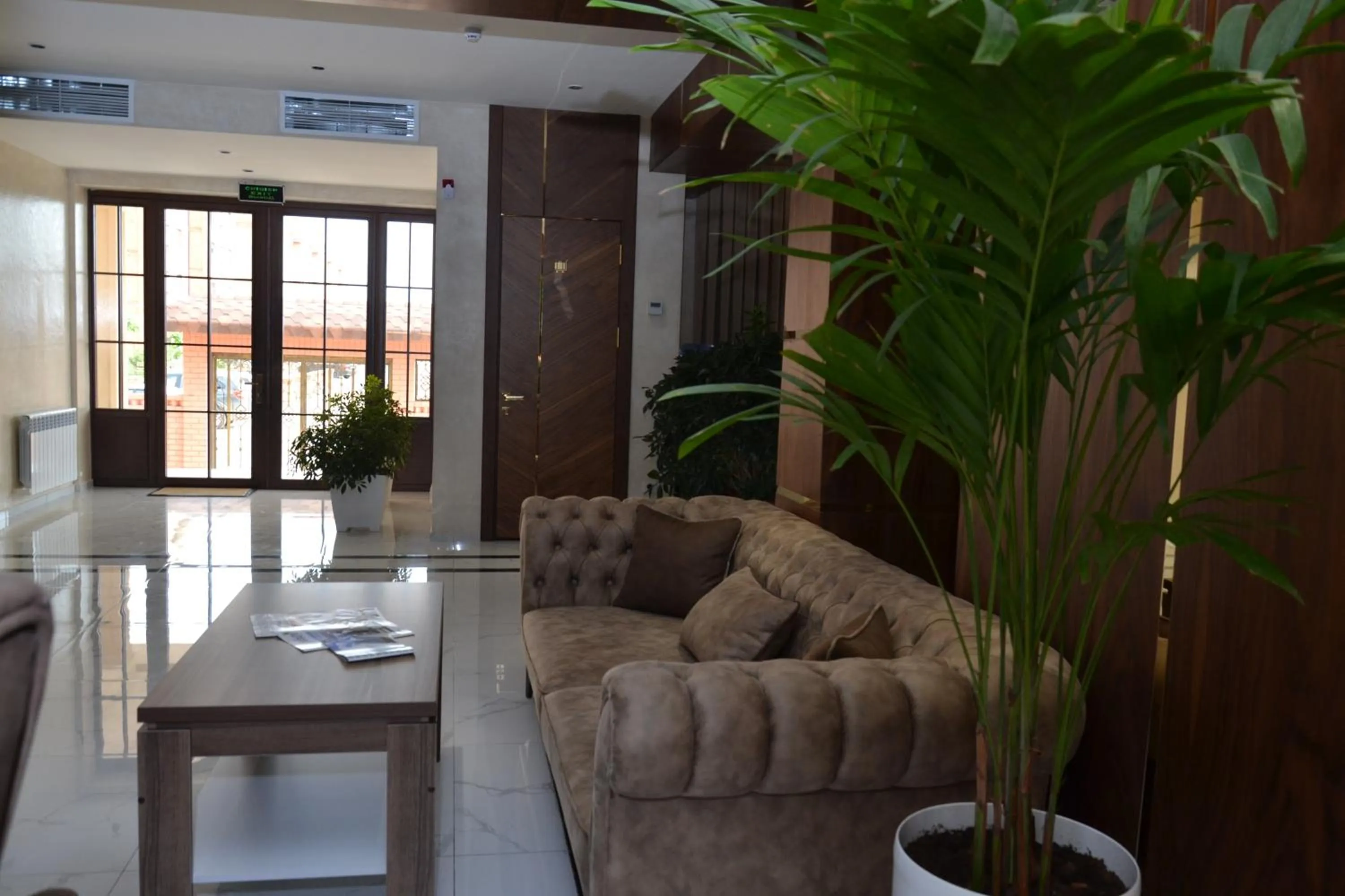 Communal lounge/ TV room in PANA HOTEL