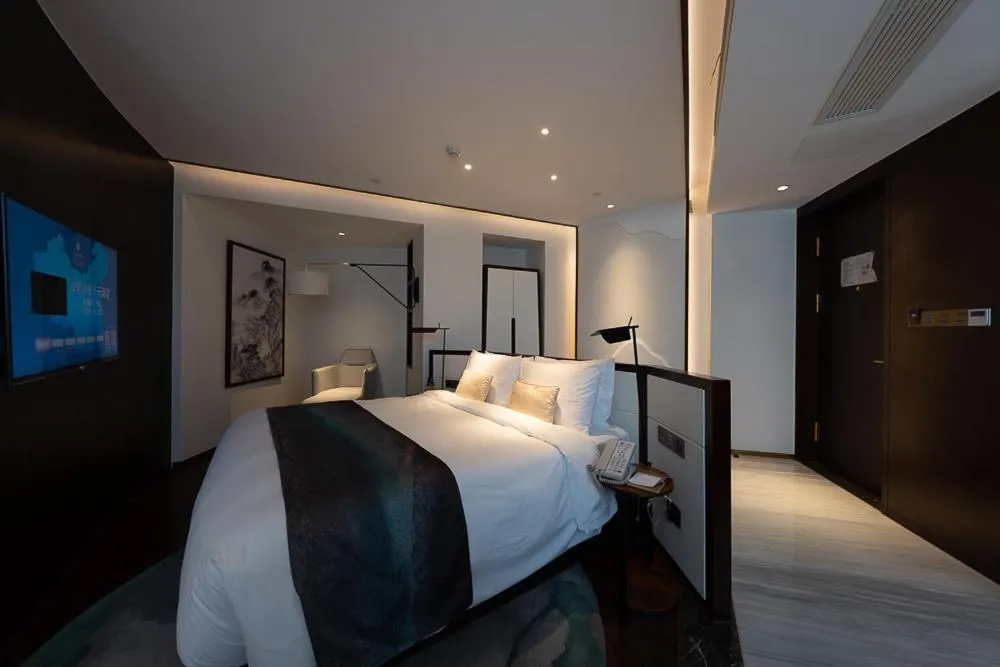 Bed in New Century Hotel Qianchao Hangzhou