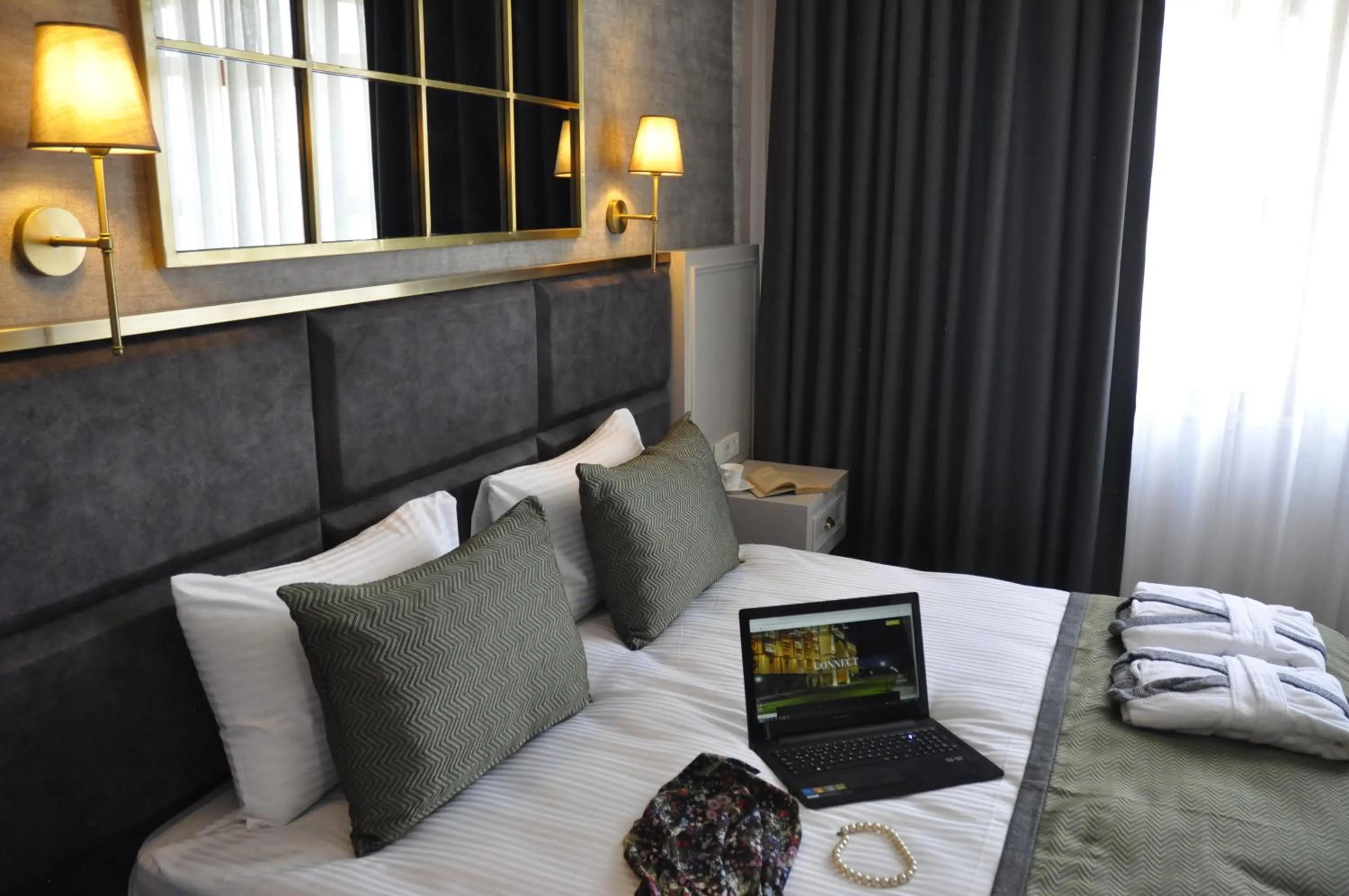 Bed in CONNECT THERMAL HOTEL