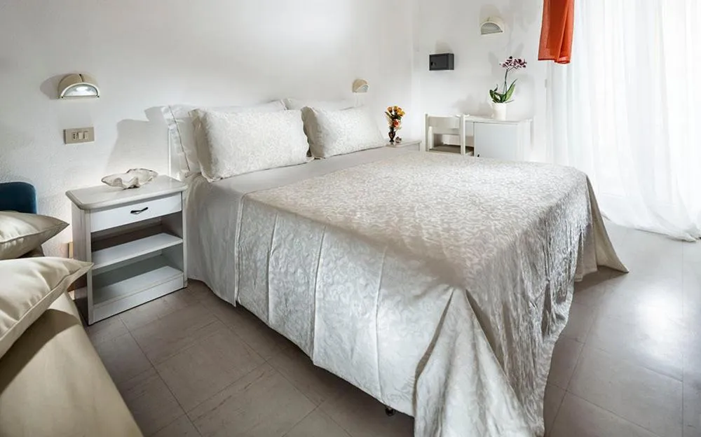 Bed in Hotel Capinera