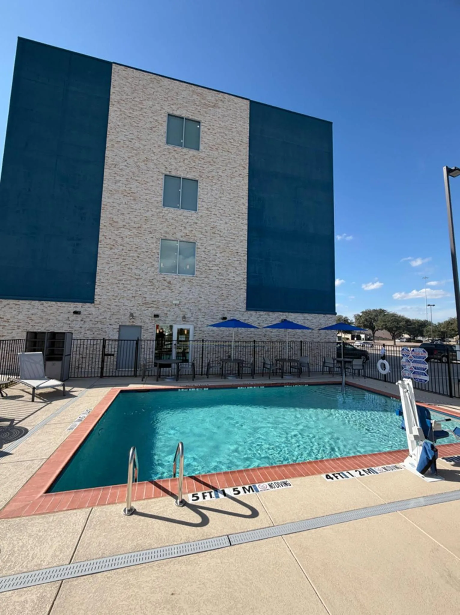 Swimming pool in HOLIDAY INN EXPRESS & SUITES DALLAS PLANO NORTH by IHG