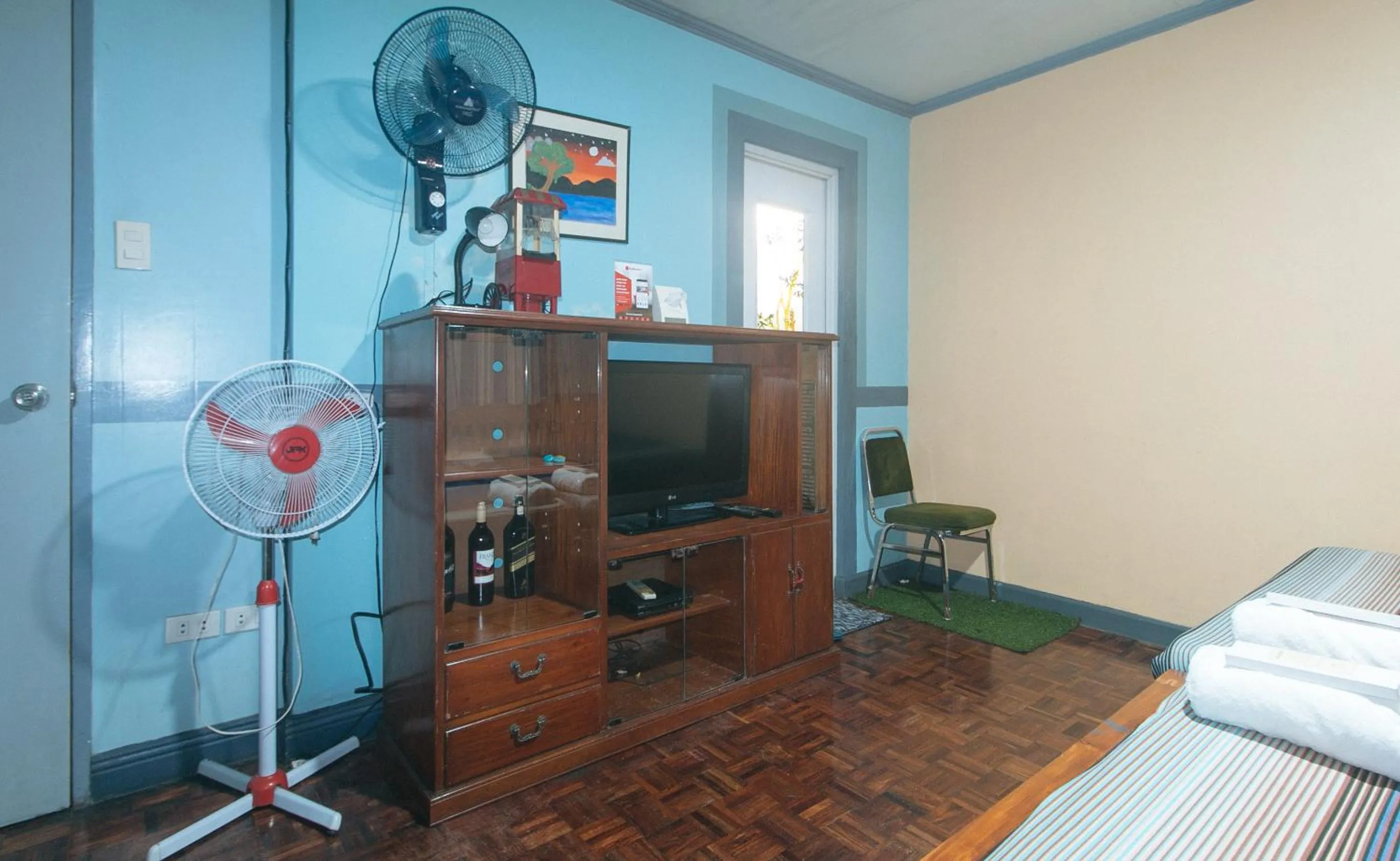 TV and multimedia in RedDoorz Hostel at MRC Residences Baguio
