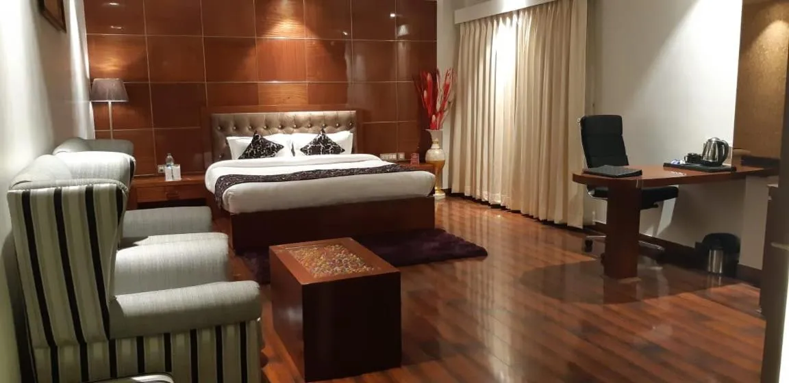 Photo of the whole room, Bed in Grand Geet Hotels