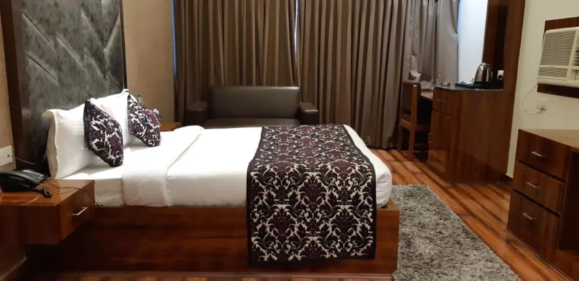 Bed in Grand Geet Hotels