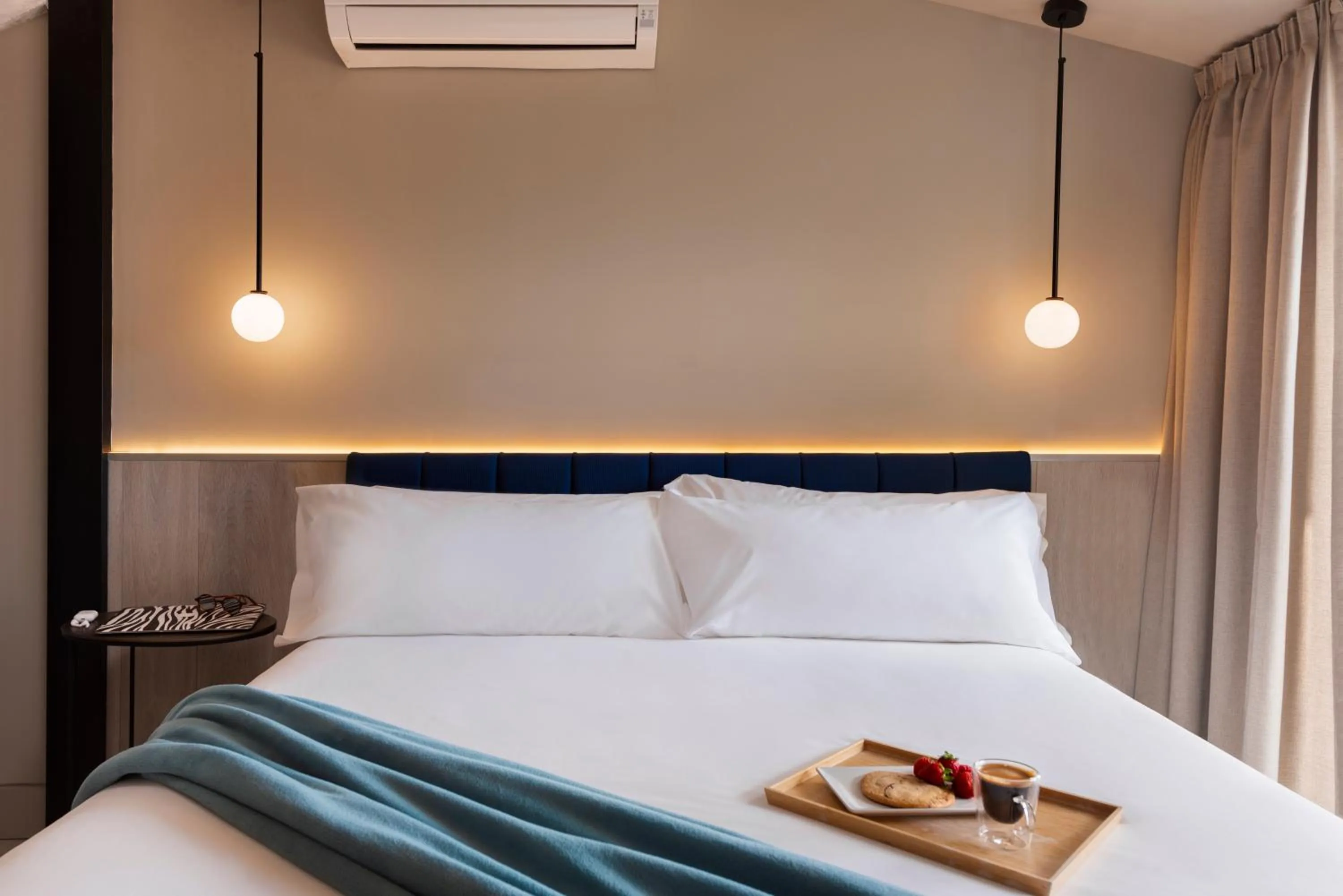 Bed in Coeo Peña Design Apartments