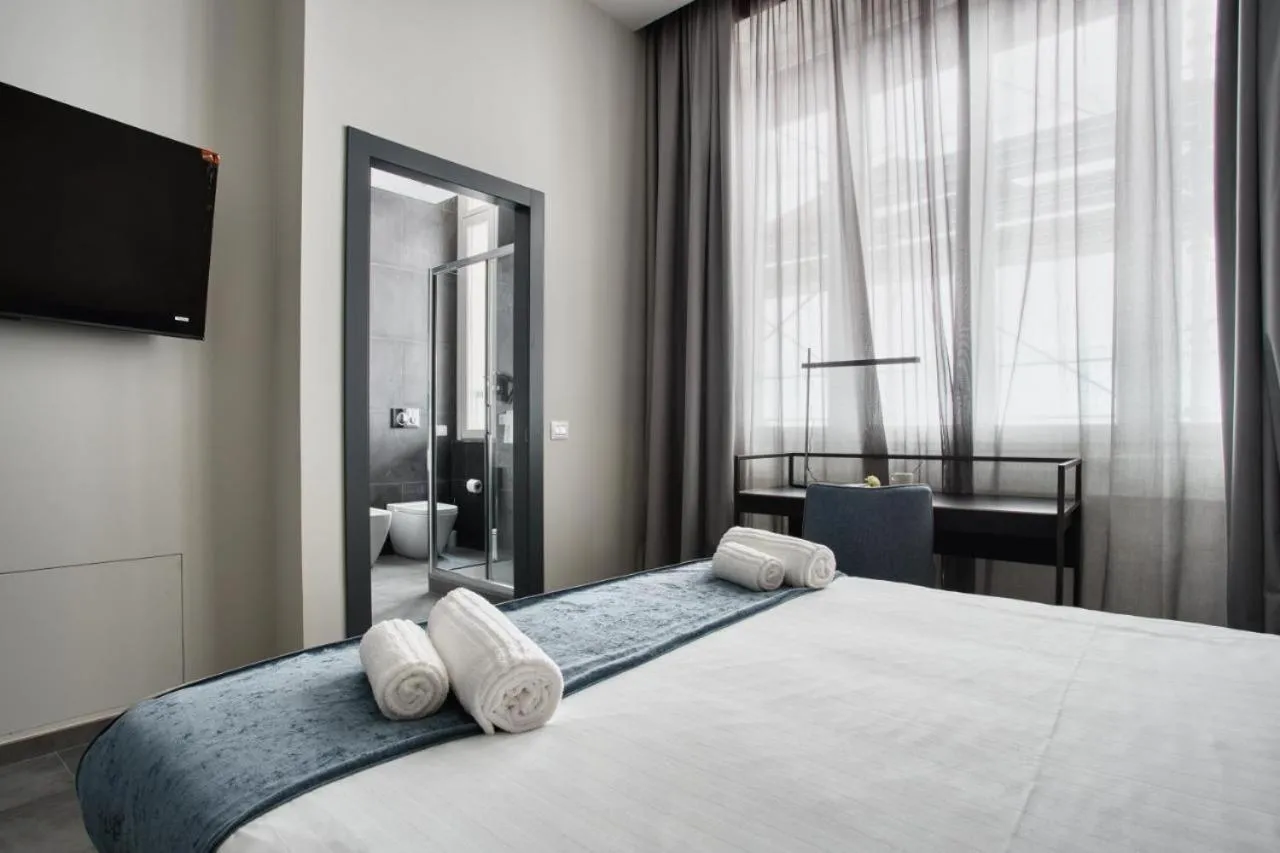 Bed in Hotel Vitruvio