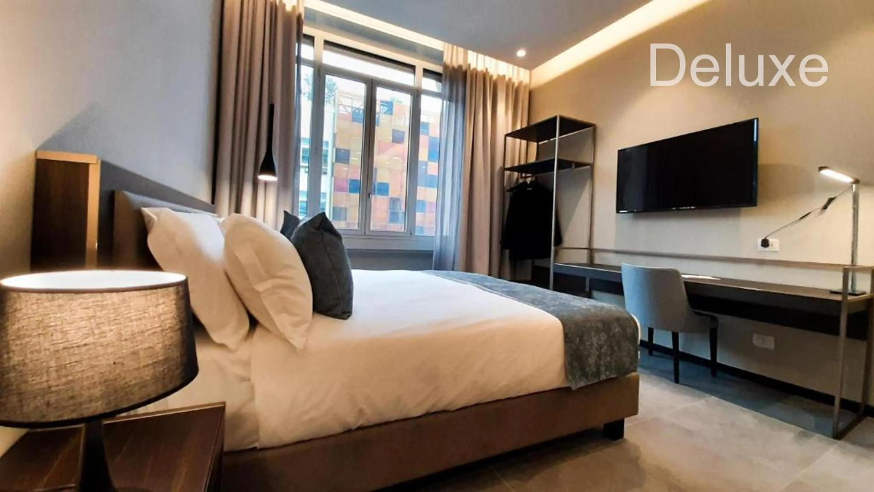 Communal lounge/ TV room, Bed in Hotel Vitruvio