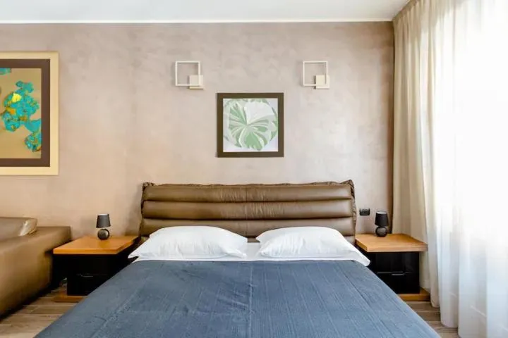 Bed in Hotel Vitruvio