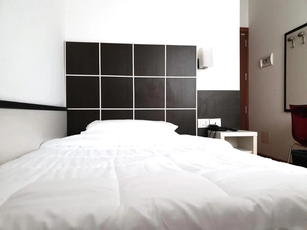 Bed in Hotel Vitruvio