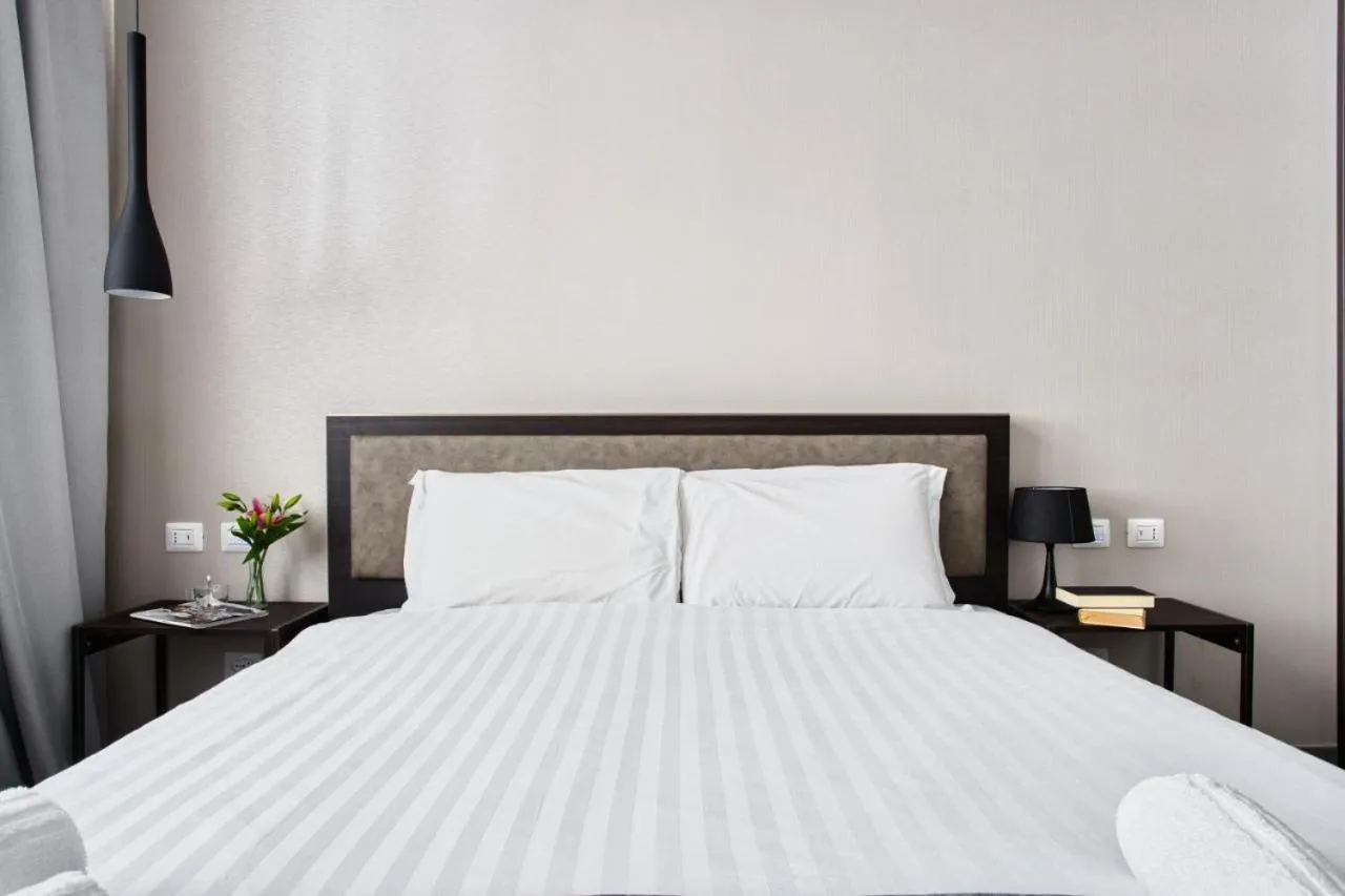 Bed in Hotel Vitruvio