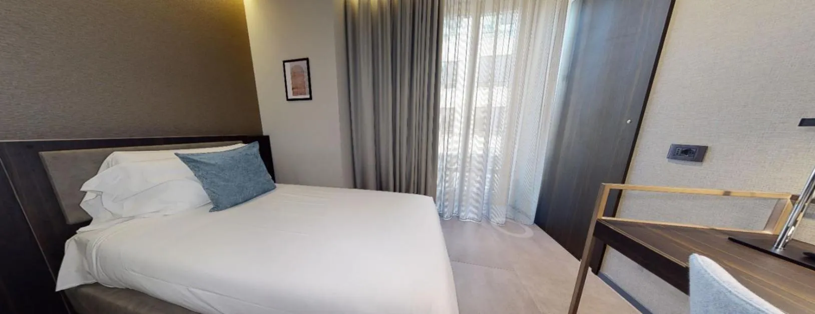 Bed in Hotel Vitruvio