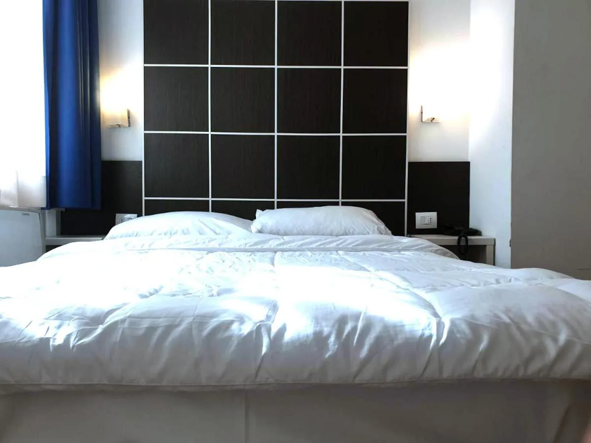 Bed in Hotel Vitruvio