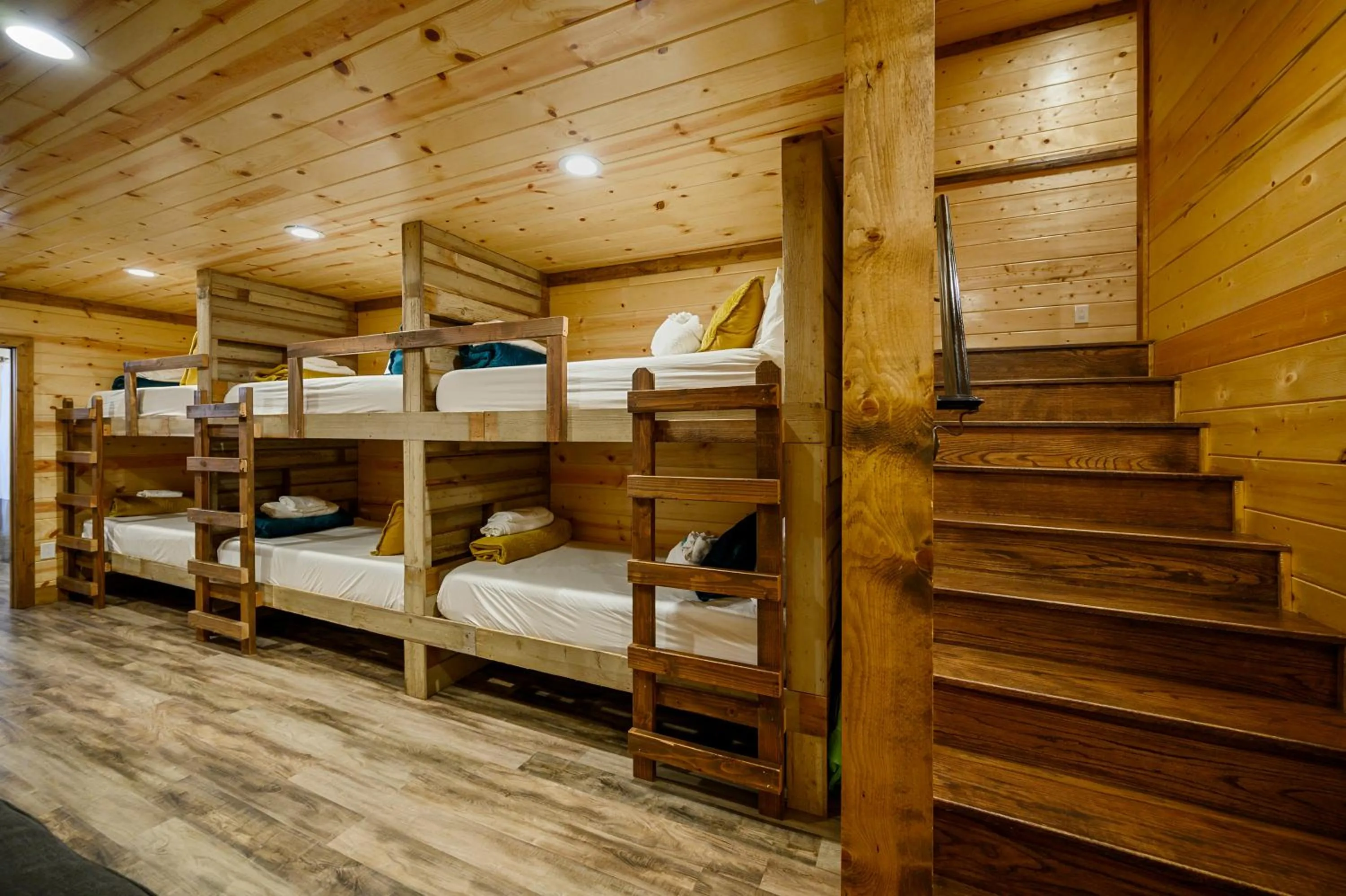 bunk bed, Bed in The Nomi Lodge - Sleeps 28 - Gorgeous Rustic Cabin, Centrally Located, Tons of Amenities