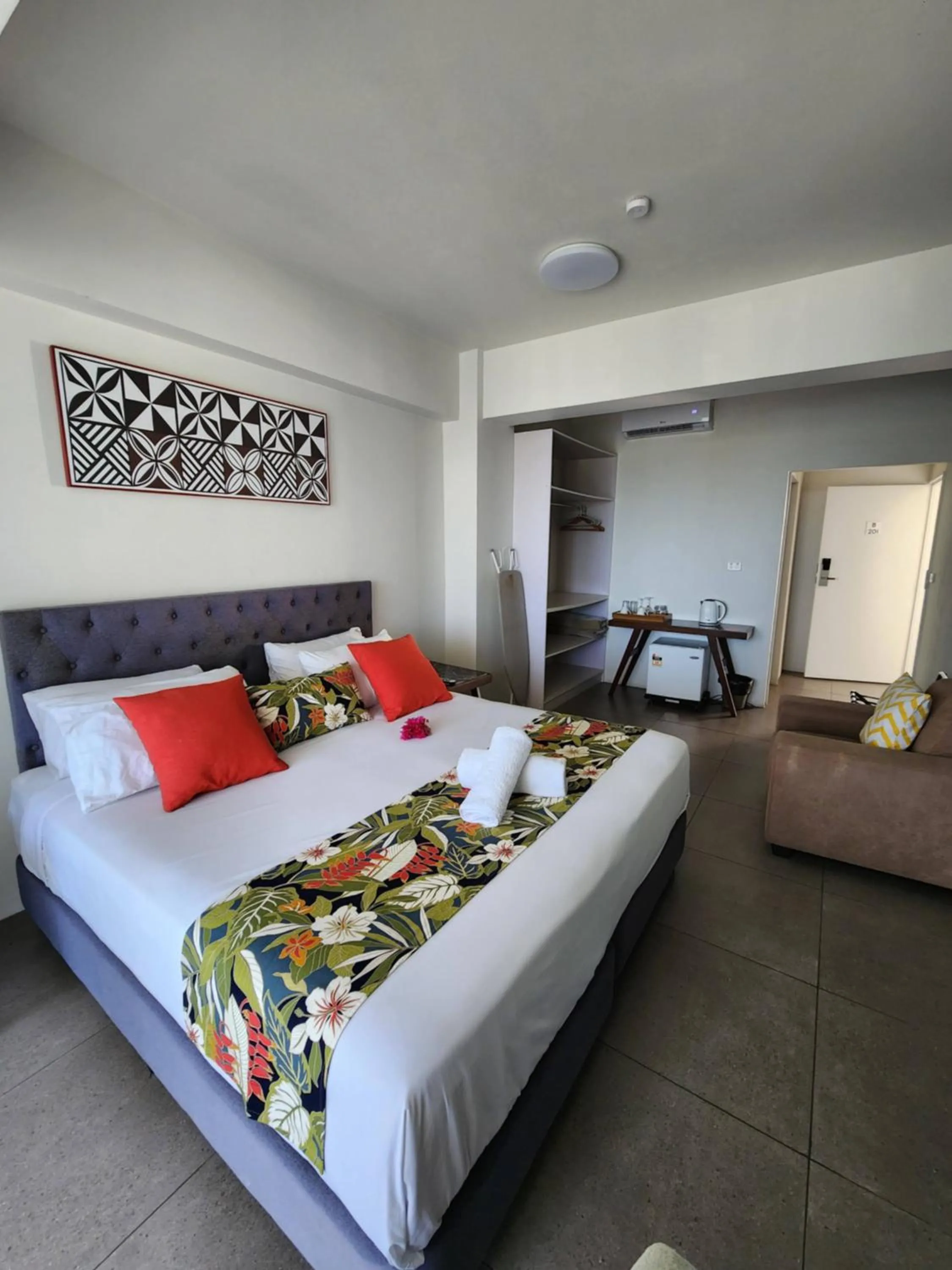 Photo of the whole room, Bed in Ramada Suites By Wyndham Seafront Coral Coast