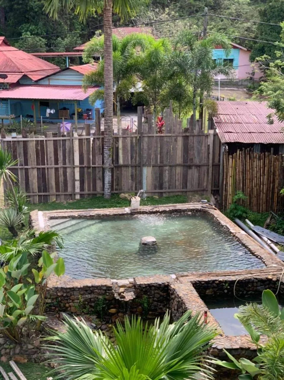Swimming pool in RIVERSIDE PALM INN SG LEMBING