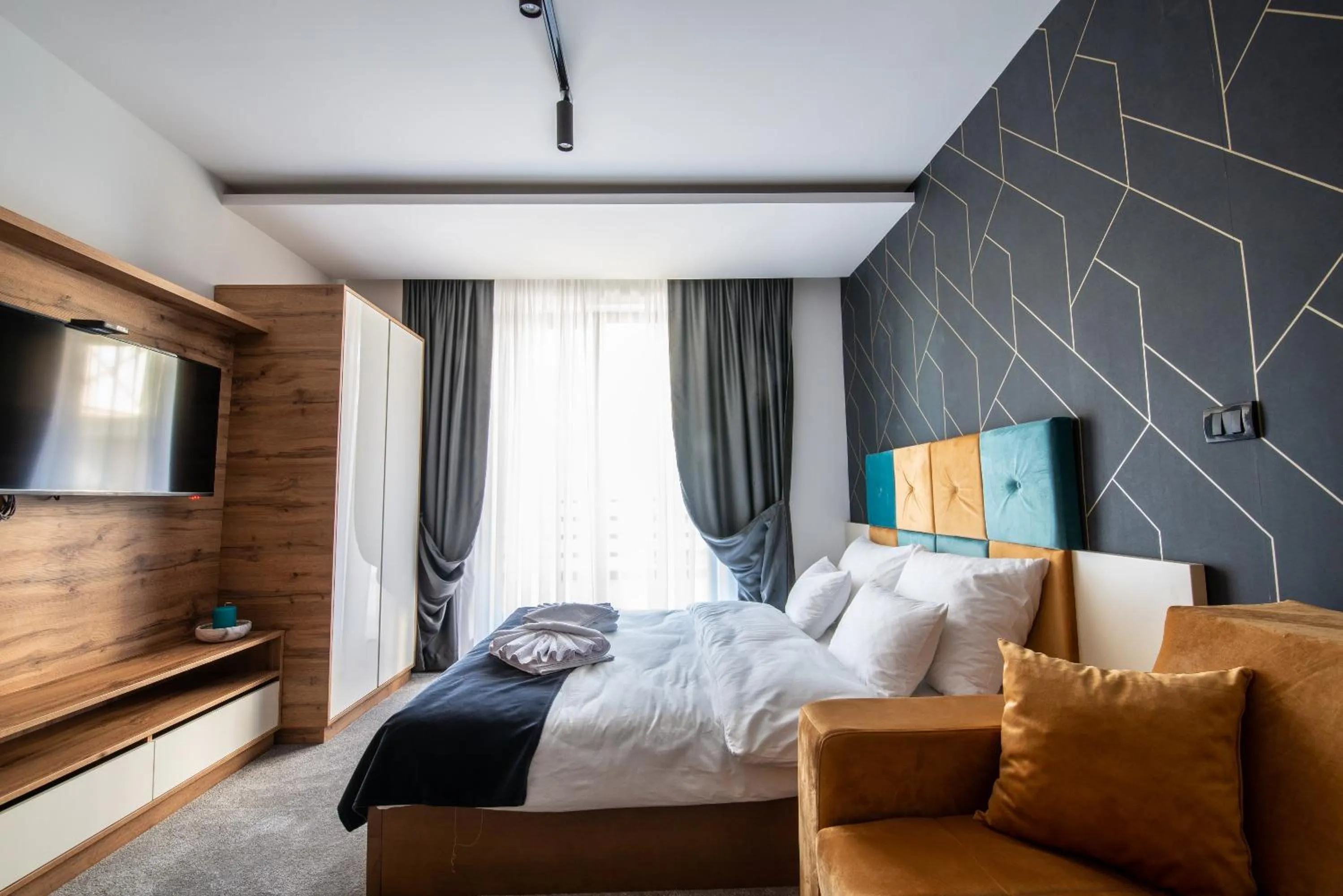 Living room, Bed in Hotel Djina - Kopaonik