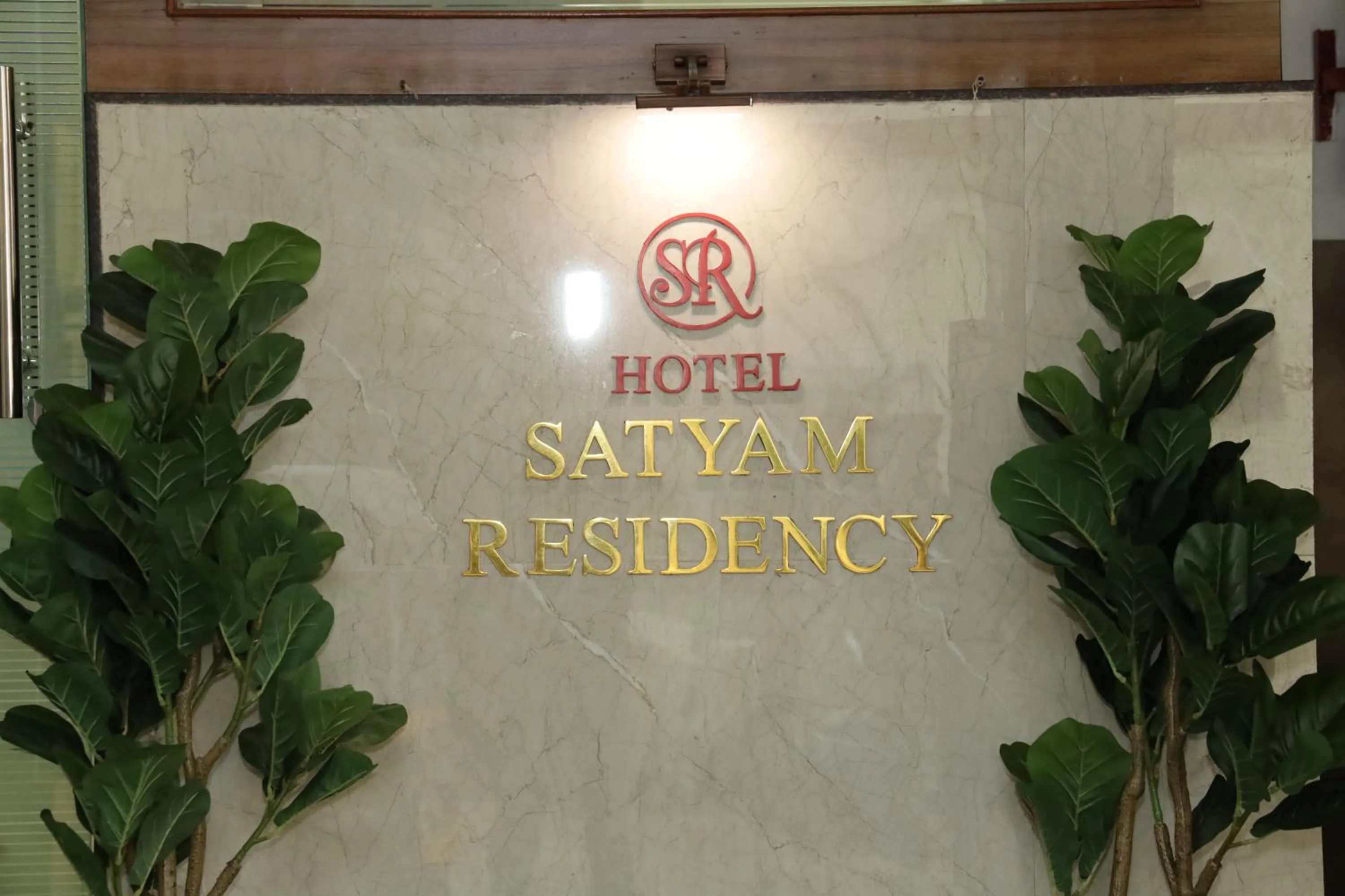 Property logo or sign in Hotel Satyam Residency