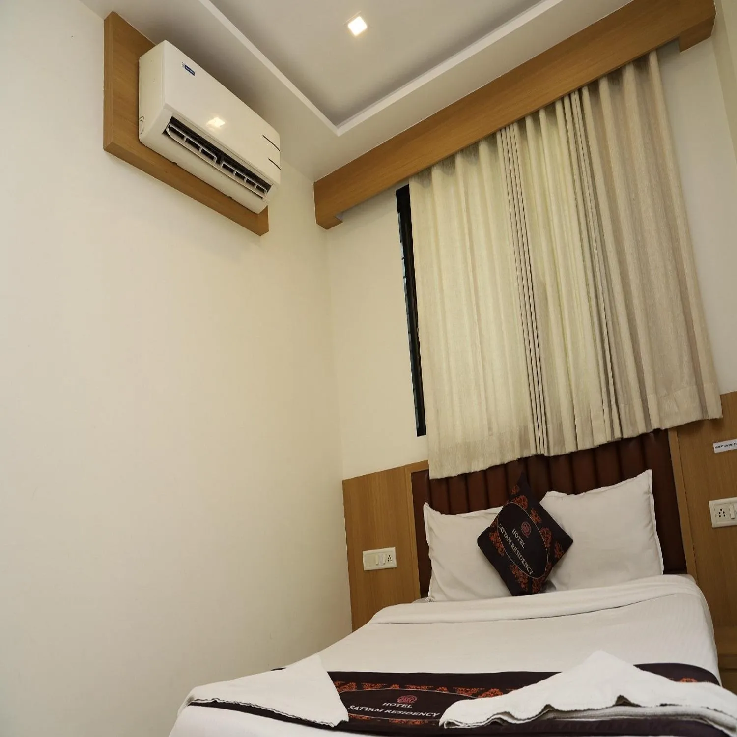 Bed in Hotel Satyam Residency