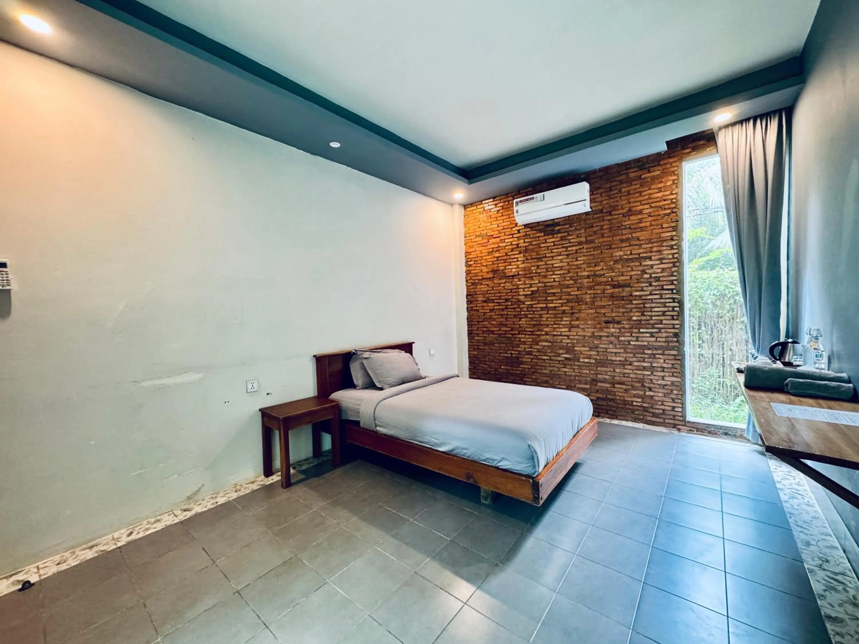 Photo of the whole room, Bed in Kampot Riverfront Boutique