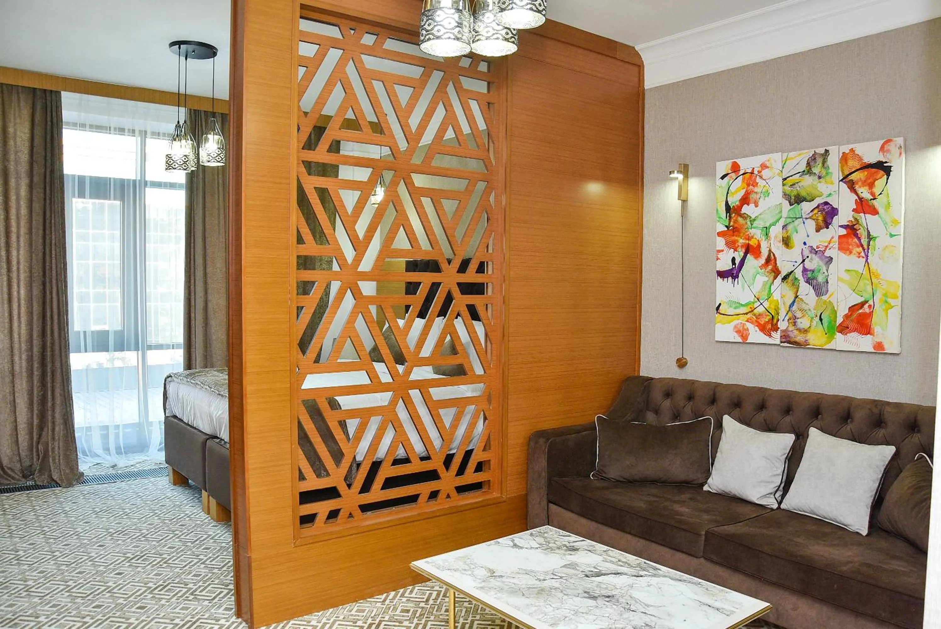 Living room, Bed in Ramada by Wyndham Turkistan