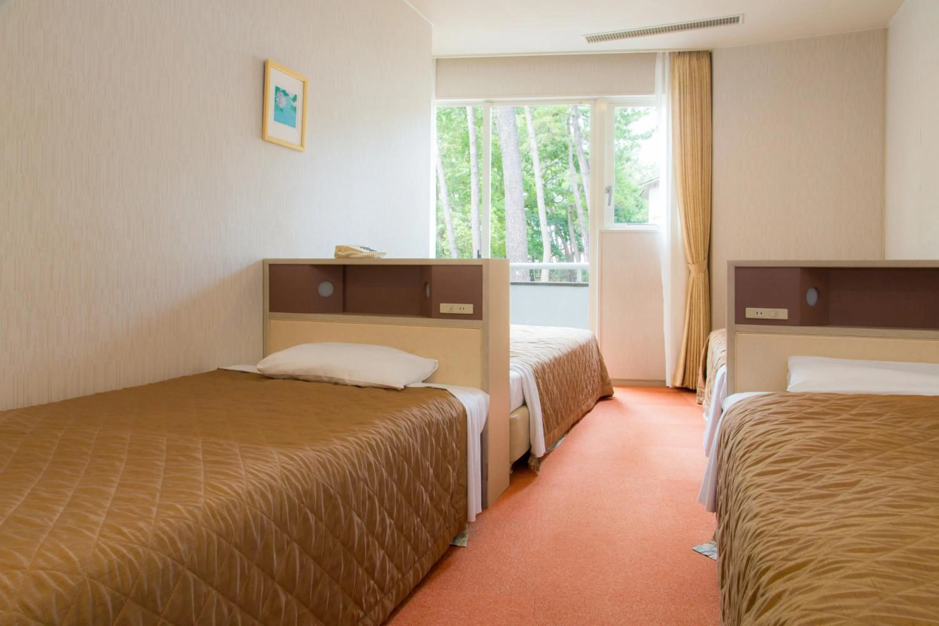 Bed in Seagaia Forest Cottages