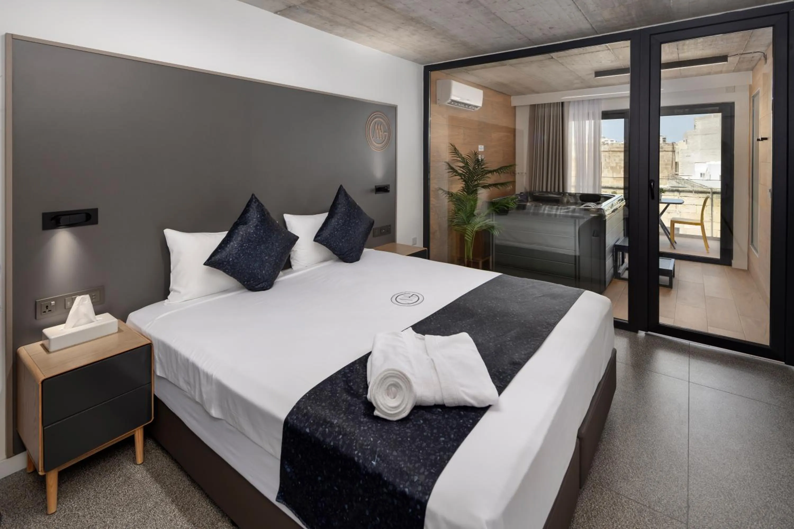 Bed in Grands Suites Hotel and Spa Sliema