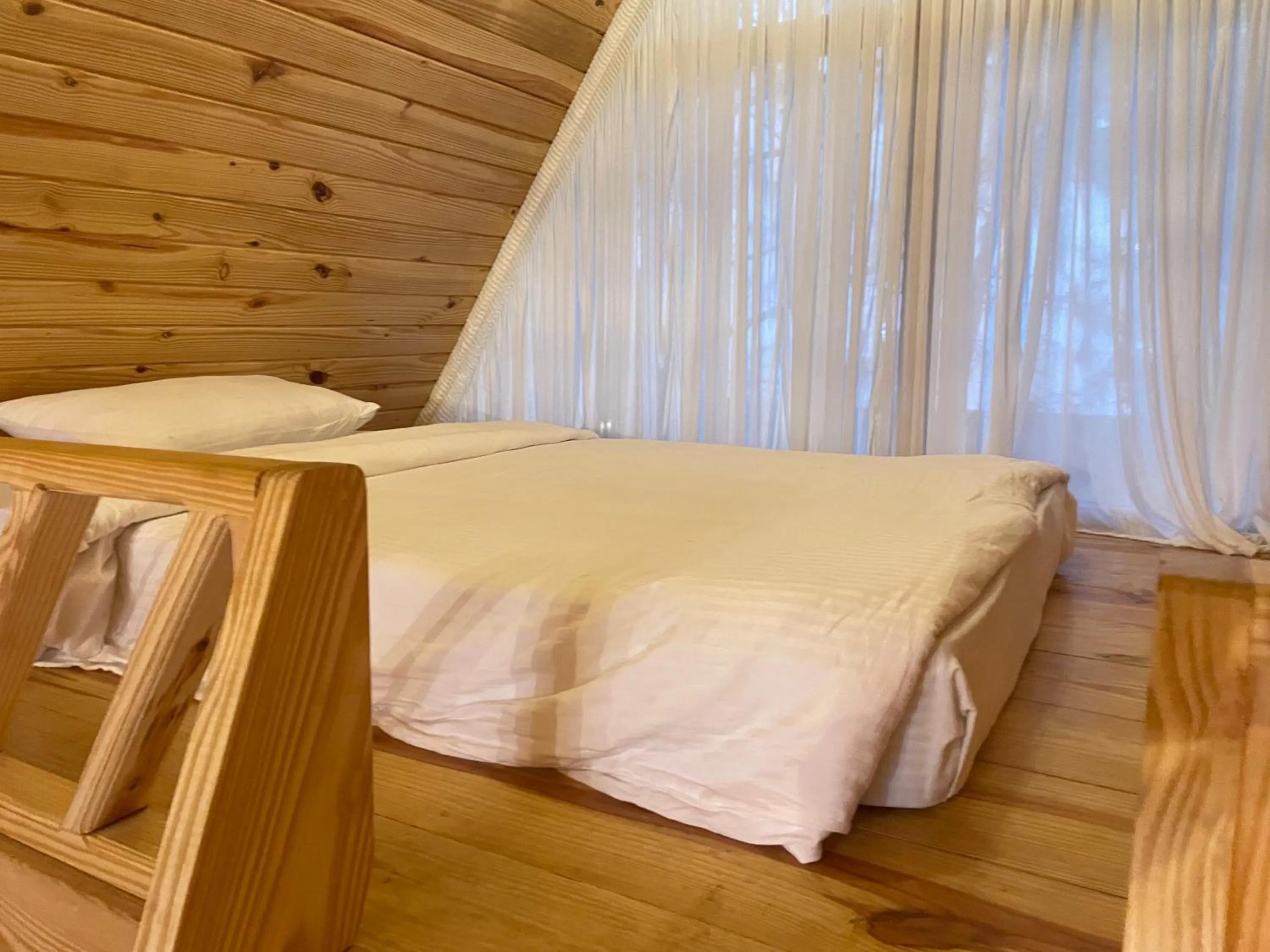 Bed in Tarangi Resort and Spa