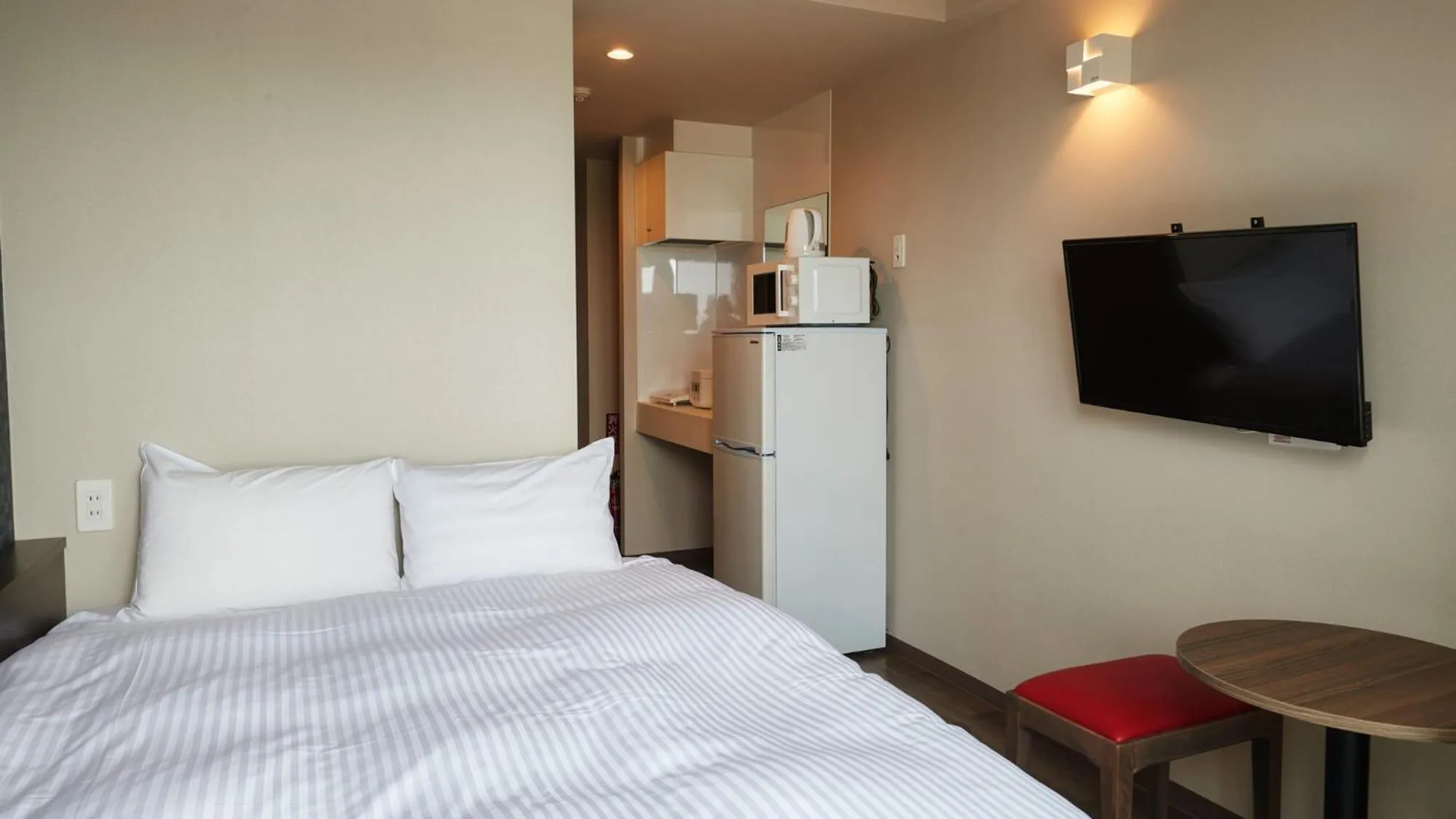 Bed in New Normal Condo in NAHA AIRPORT ニューノーマルコンドイン那覇エアポート