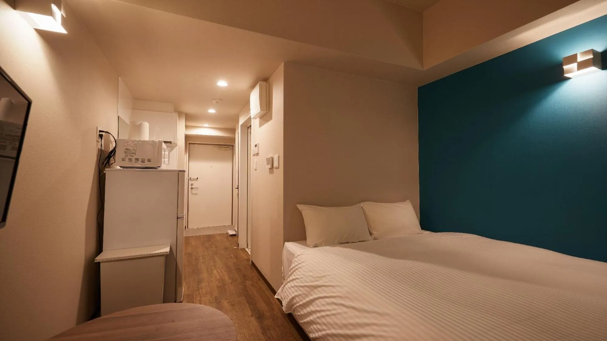 Bed in New Normal Condo in NAHA AIRPORT ニューノーマルコンドイン那覇エアポート