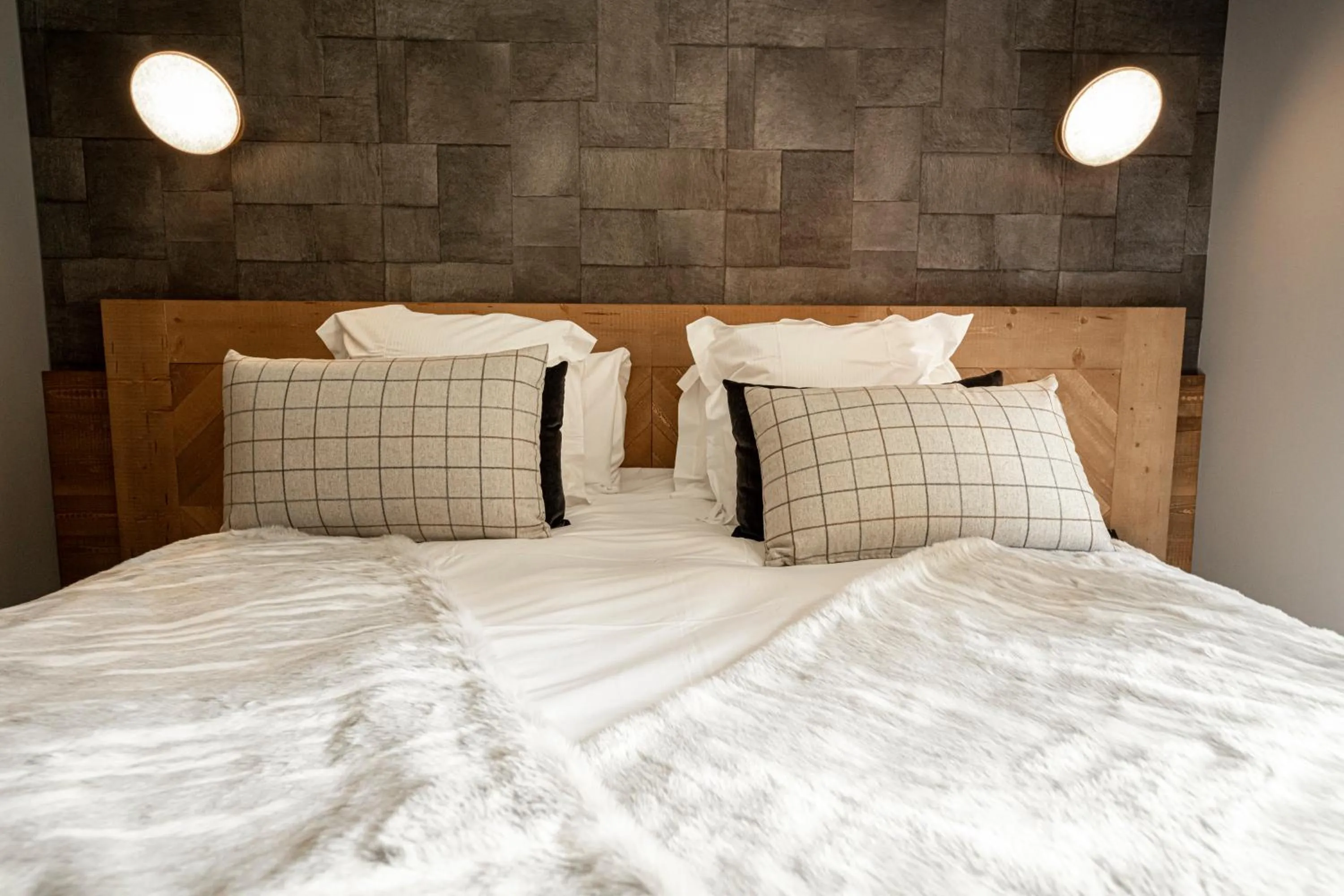 Bed in Pure Montagne Resort & Spa