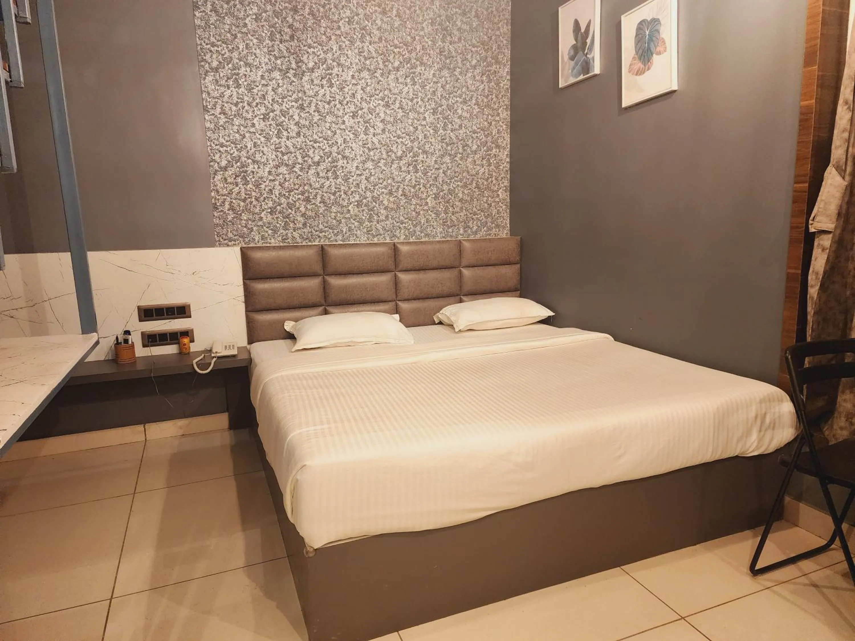 Bed in Passiflora Beach Resort Alibaug