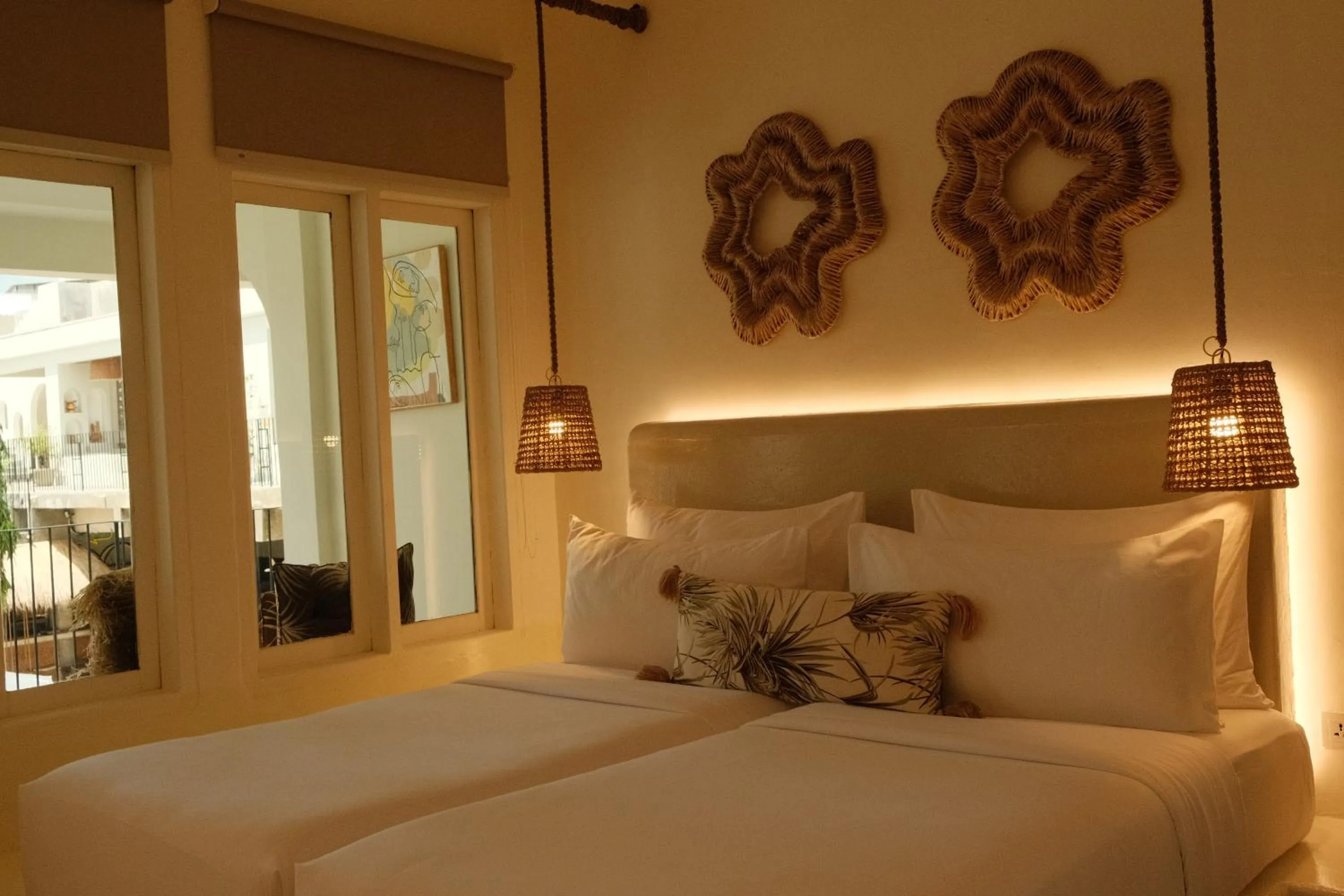Bed in El Tropico Boutique Hotel