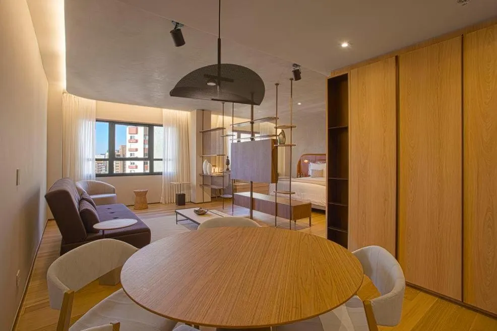 Seating area in QOYA Hotel Curitiba, Curio Collection by Hilton