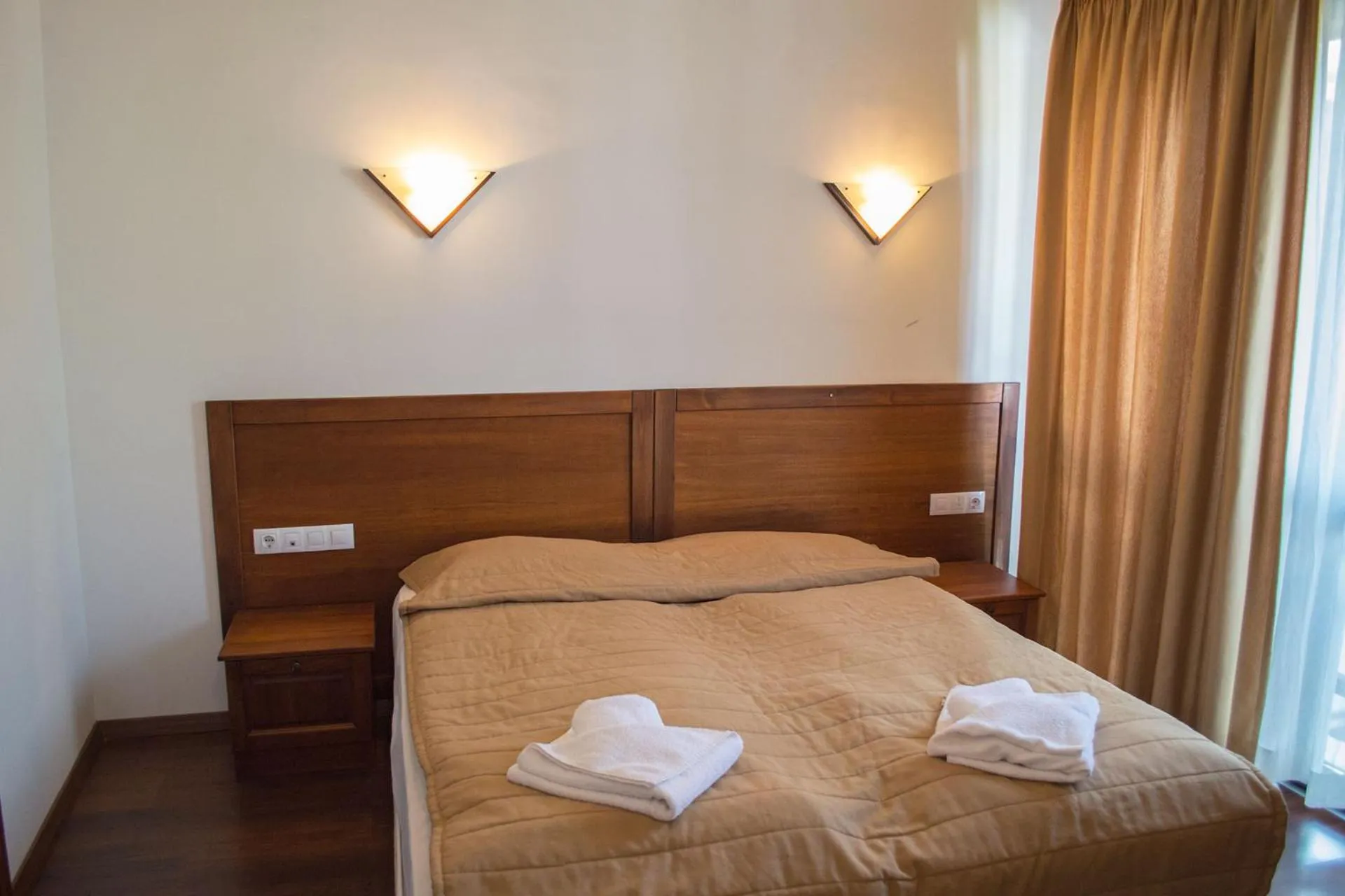 Bed in Winslow Infinity Aparthotel