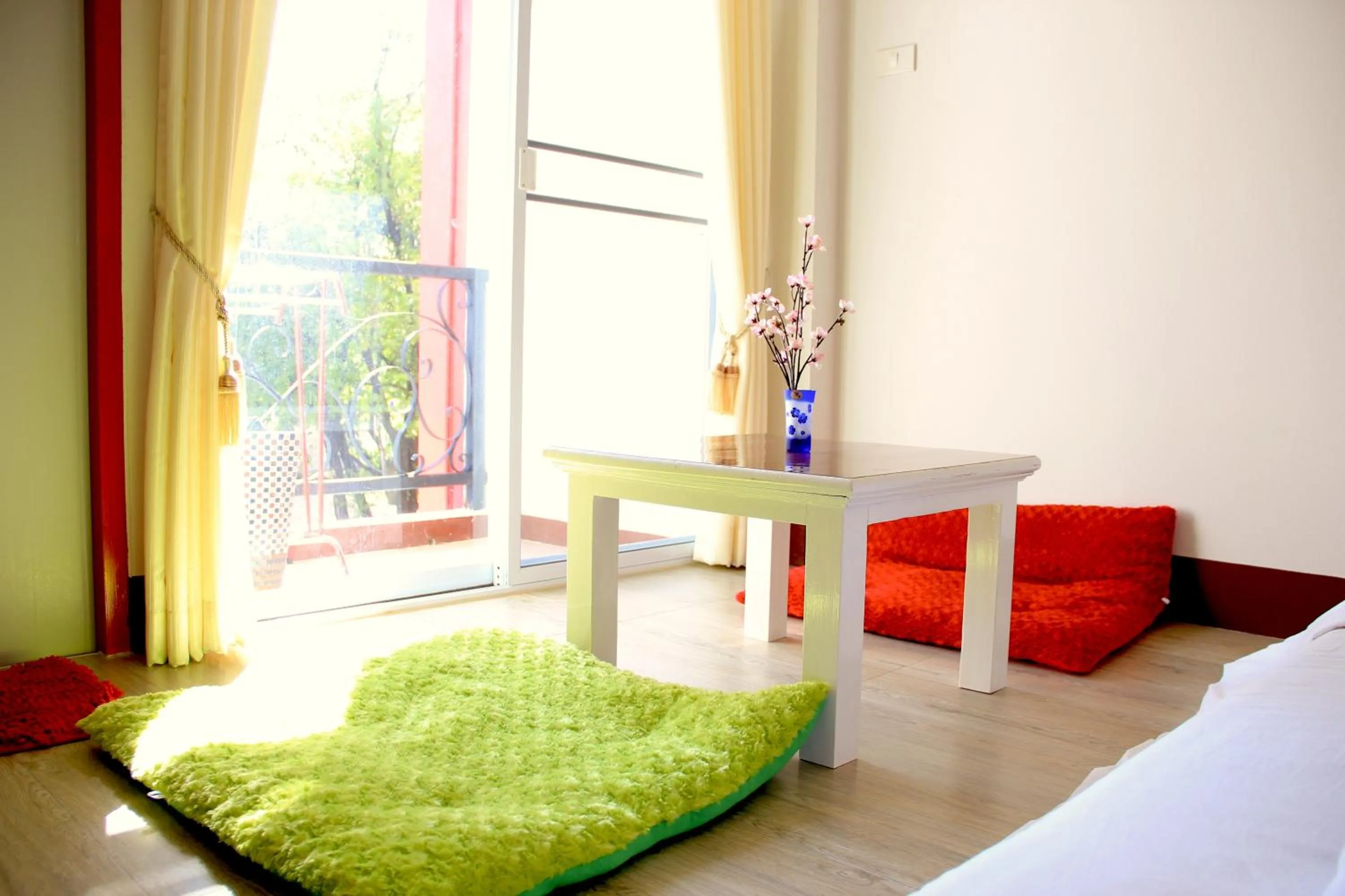 Seating area, Bed in The Cottage Lampang