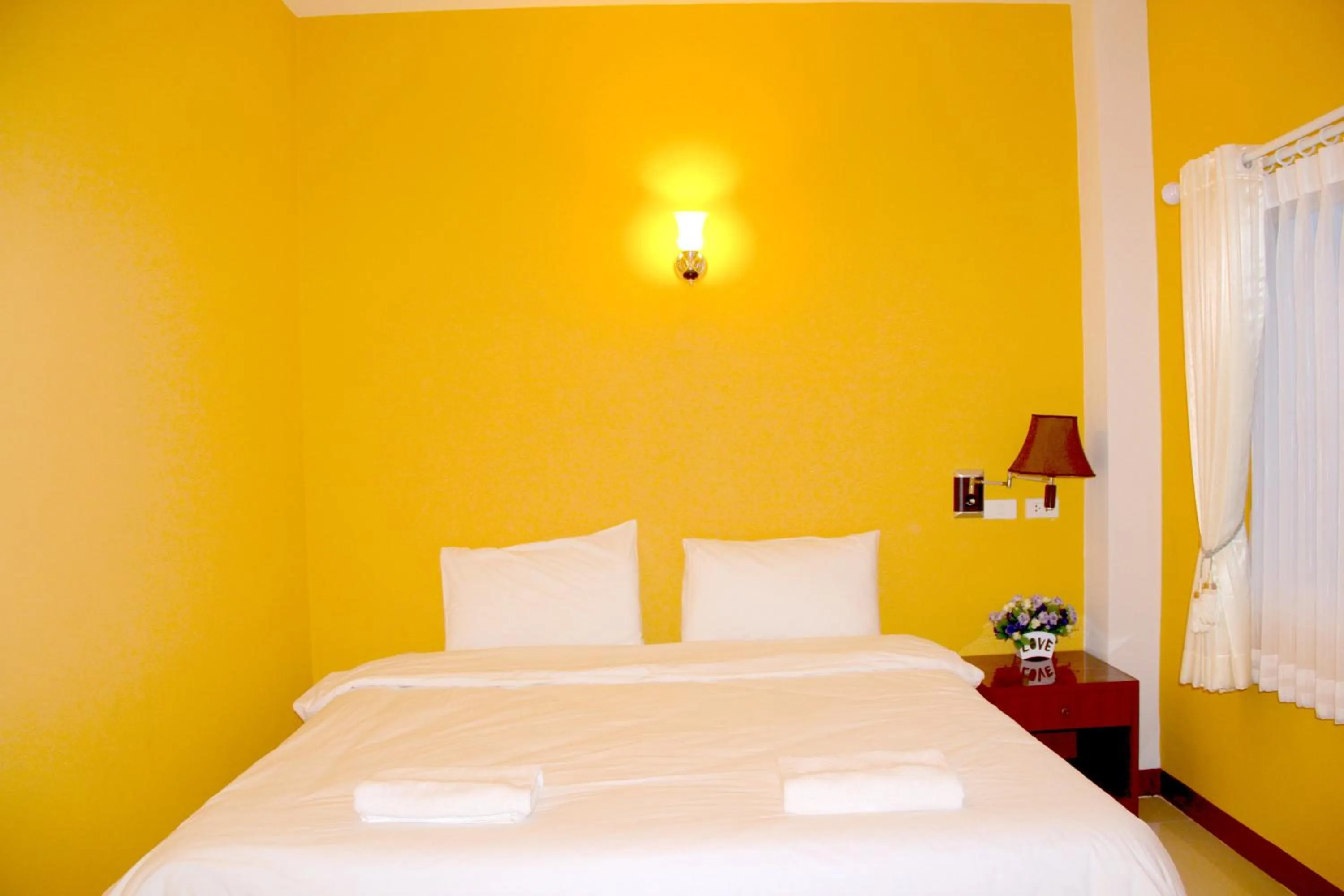 Bed in The Cottage Lampang