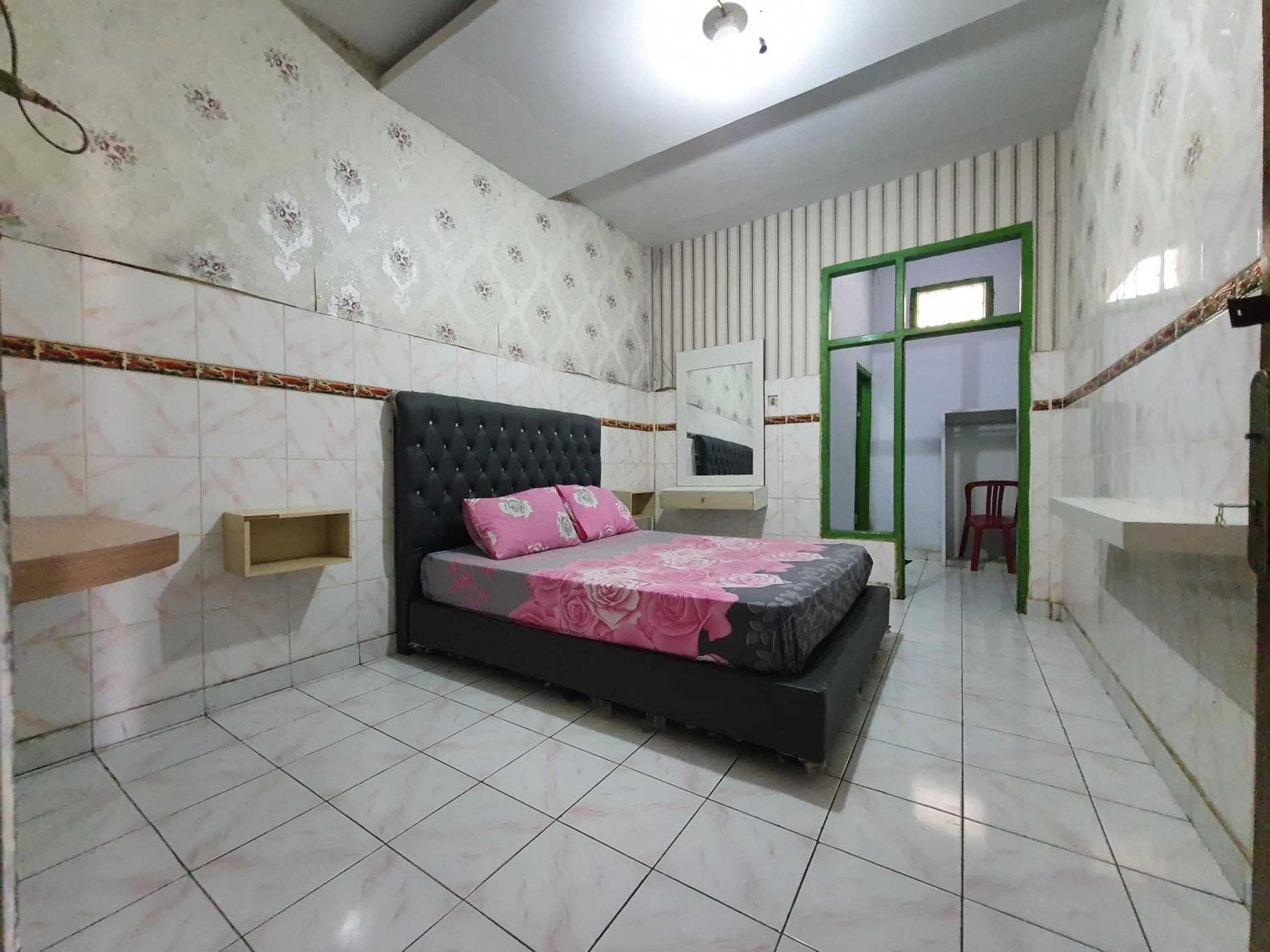 Bedroom in Hotel O Losmen Bunda Arema