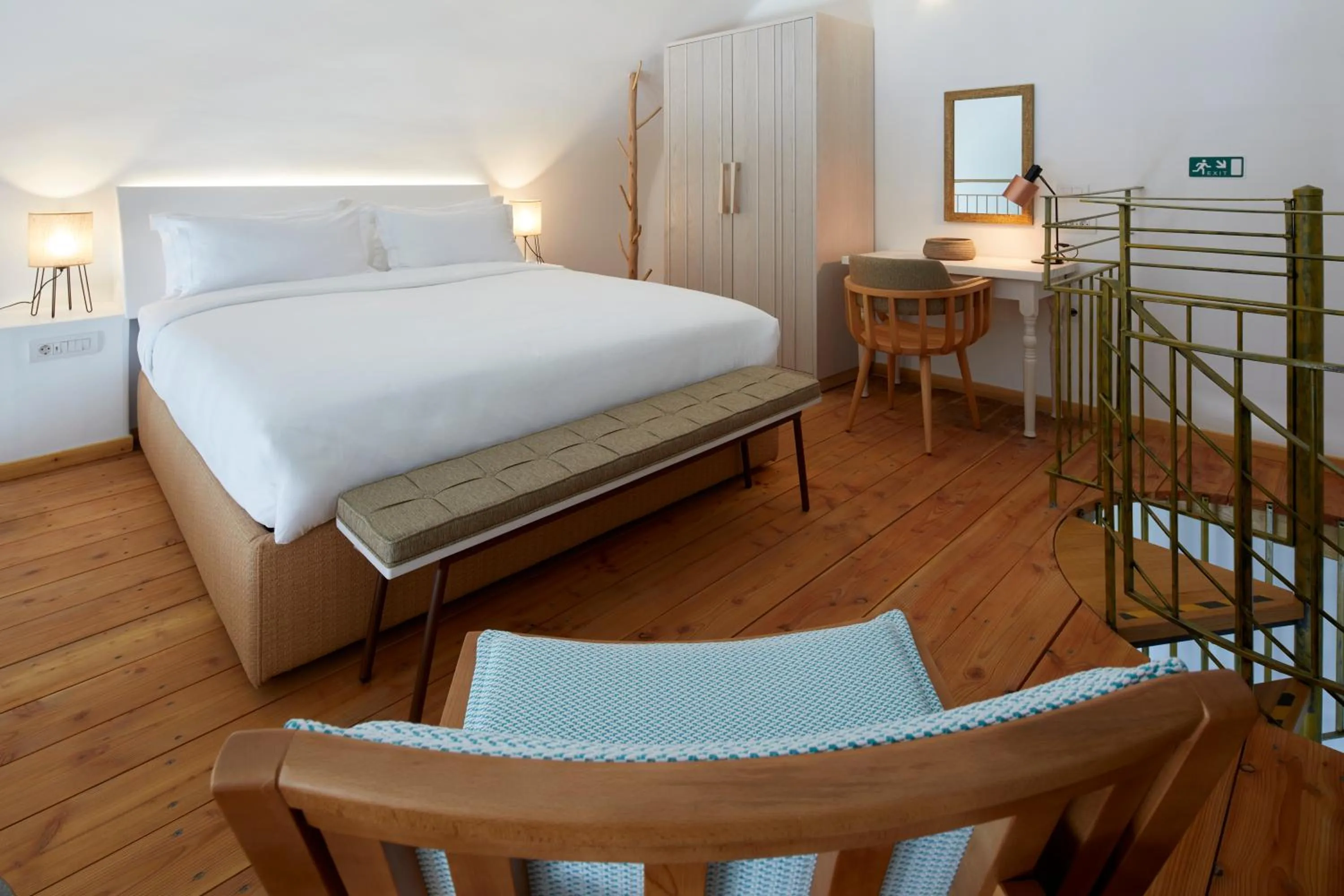 Bed in Sea Breeze Santorini Beach Resort, Curio By Hilton