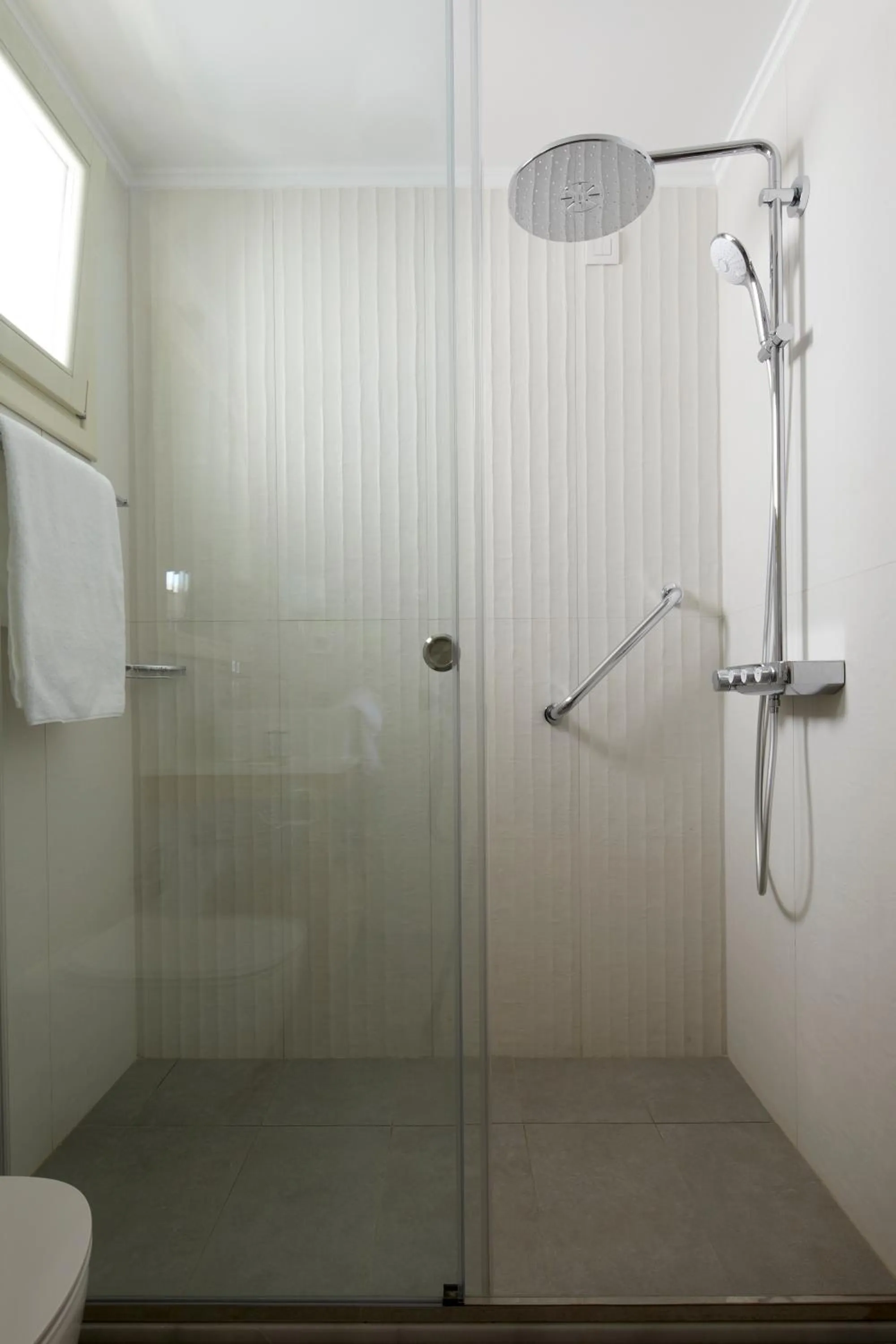 Shower in Sea Breeze Santorini Beach Resort, Curio By Hilton