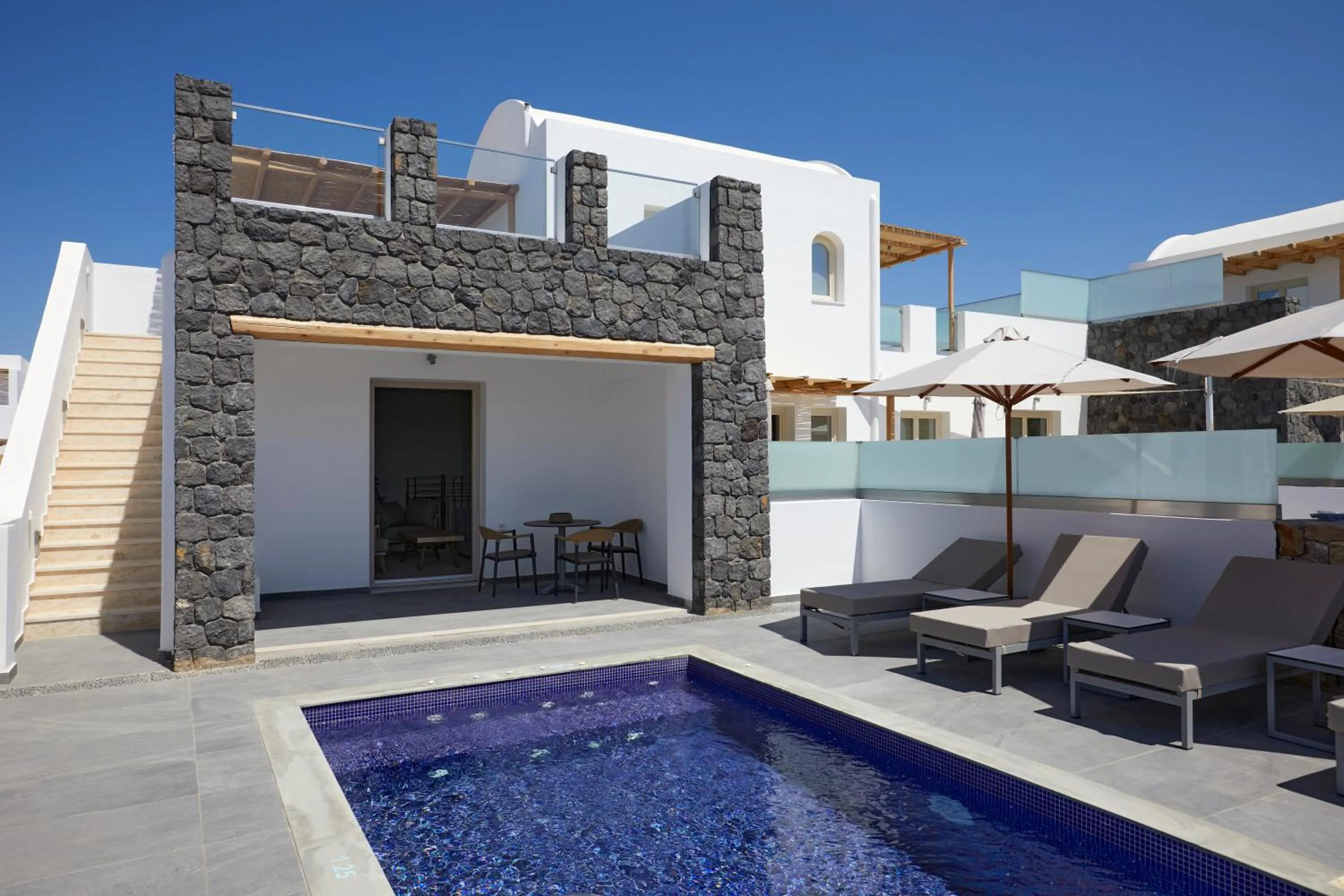 Property building in Sea Breeze Santorini Beach Resort, Curio By Hilton