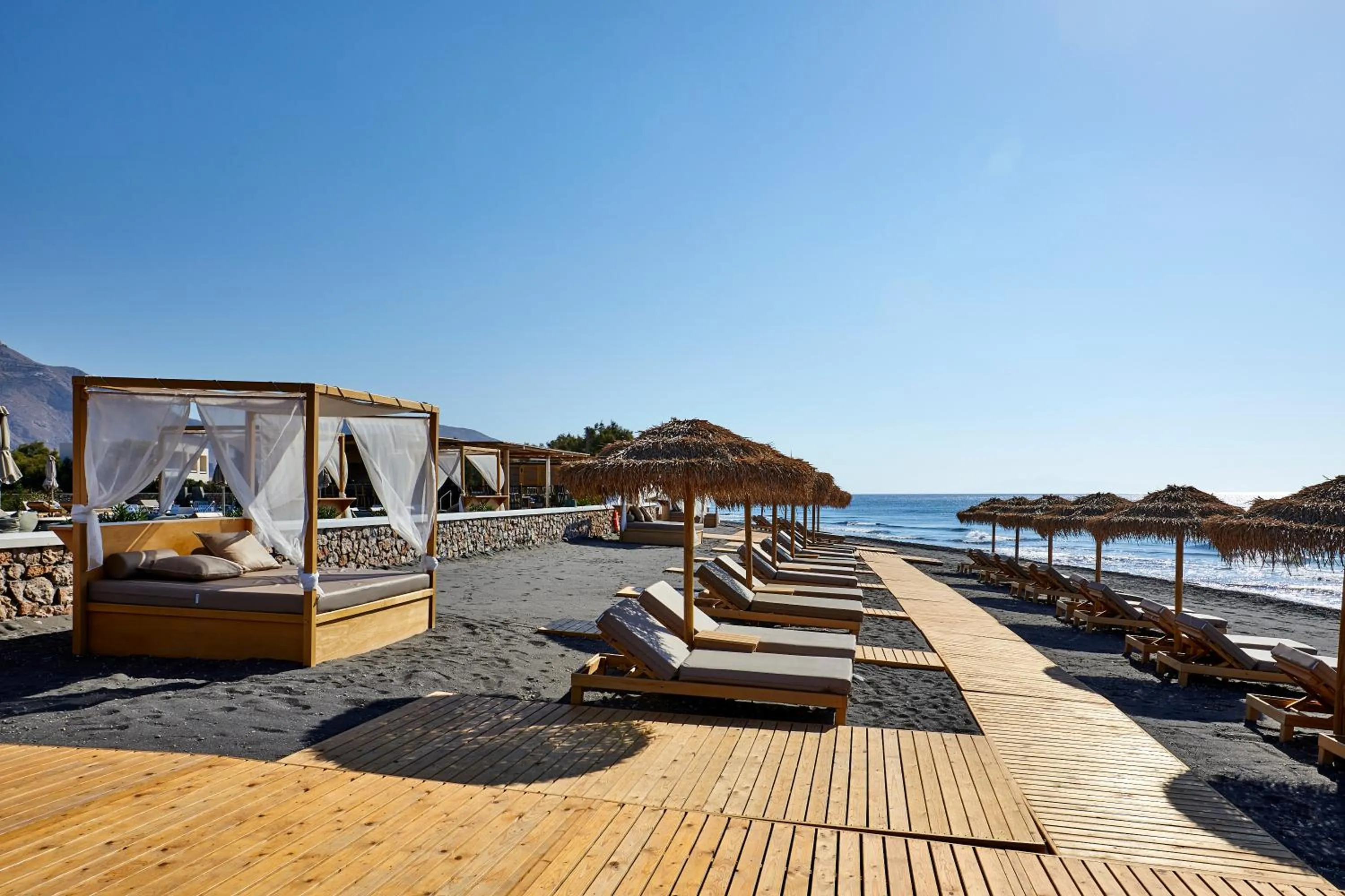 Beach in Sea Breeze Santorini Beach Resort, Curio By Hilton