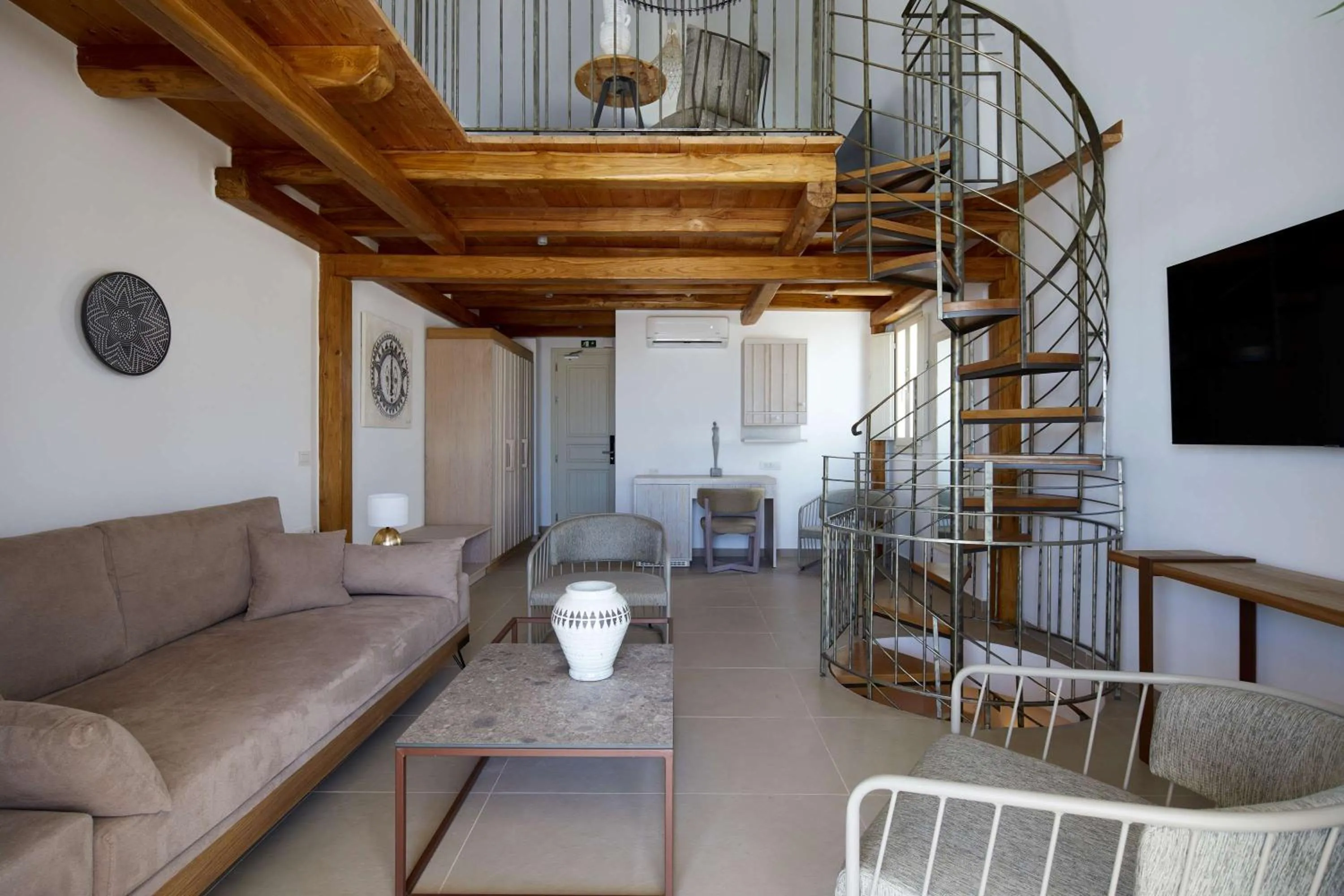 Living room in Sea Breeze Santorini Beach Resort, Curio By Hilton