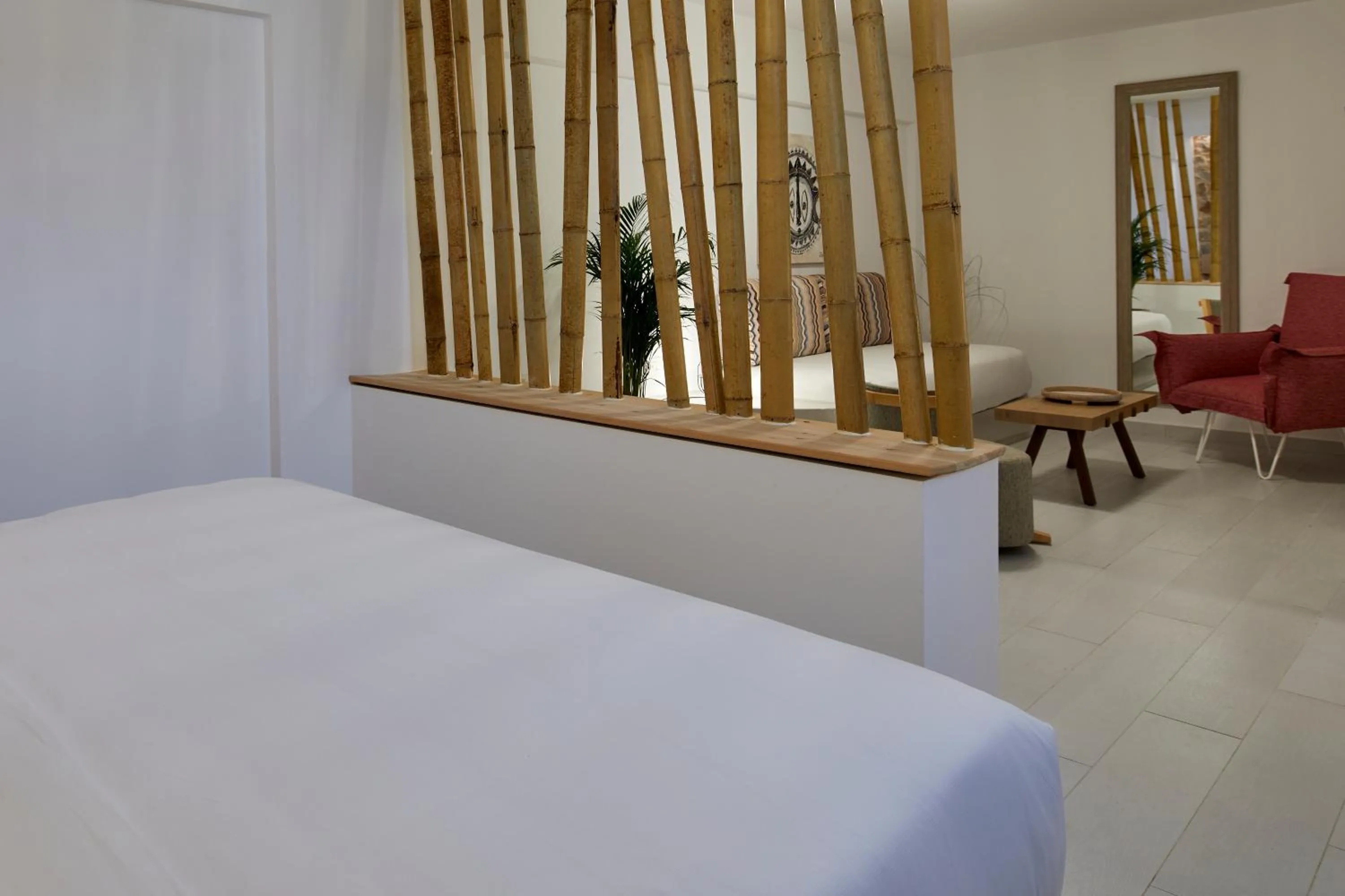 Bed in Sea Breeze Santorini Beach Resort, Curio By Hilton