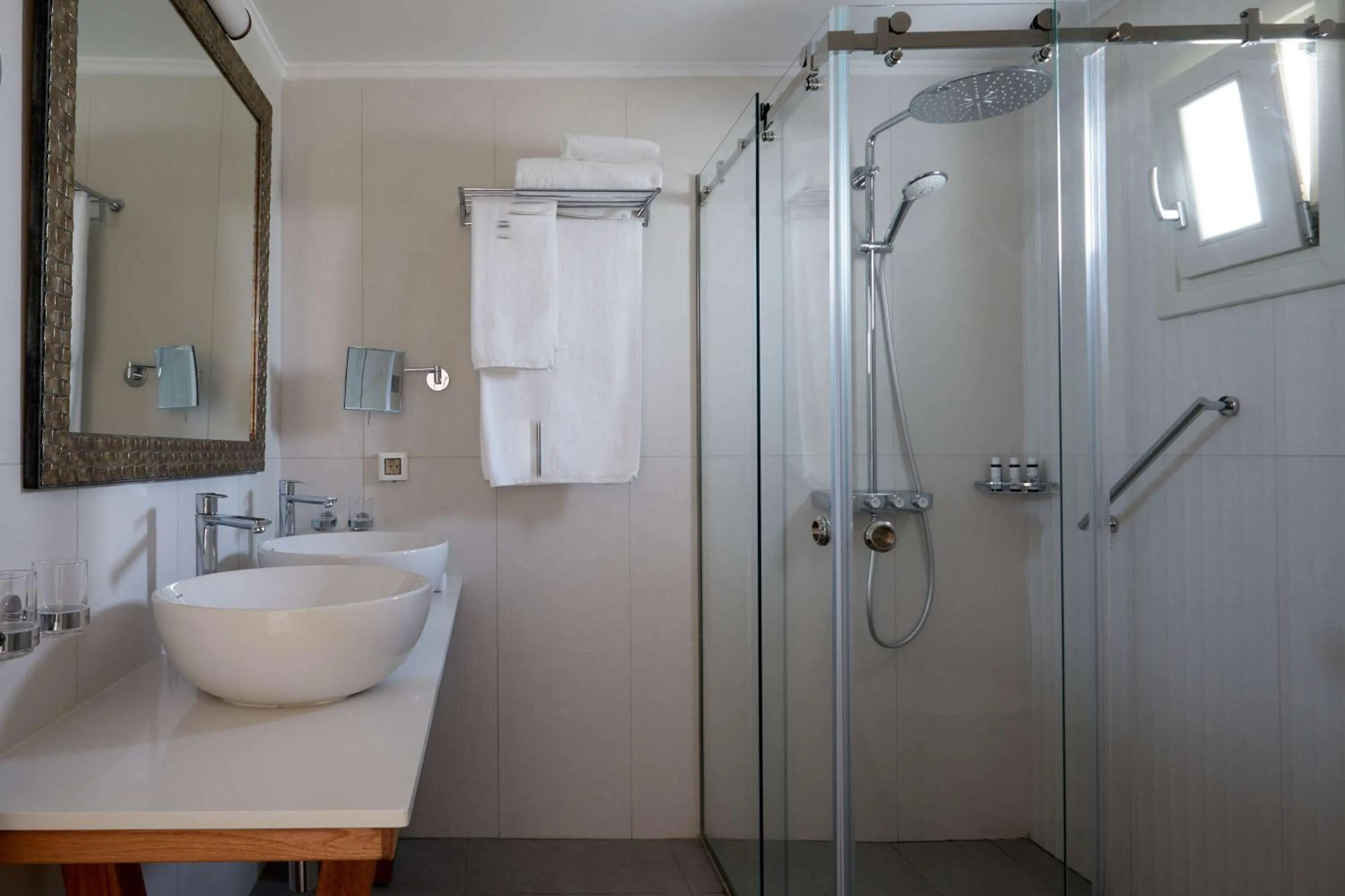 Bathroom in Sea Breeze Santorini Beach Resort, Curio By Hilton