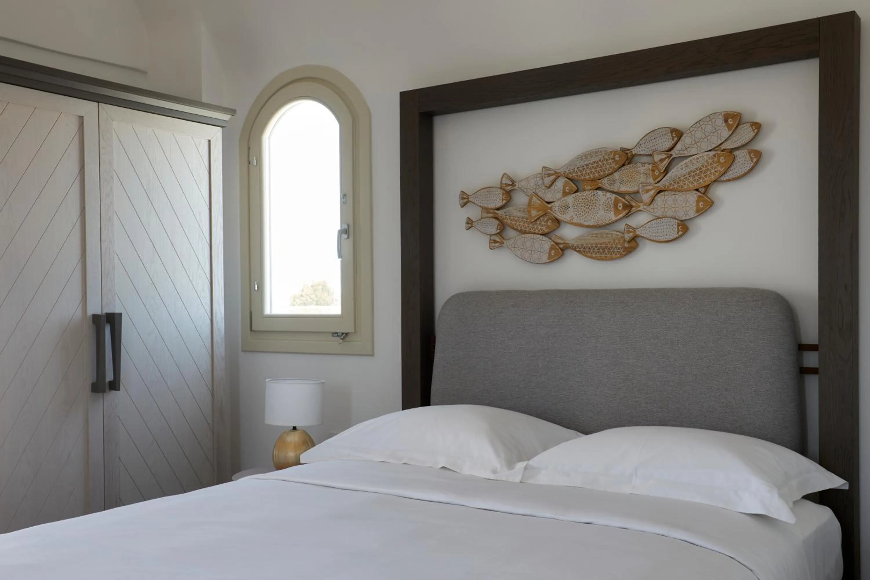 Bed in Sea Breeze Santorini Beach Resort, Curio By Hilton