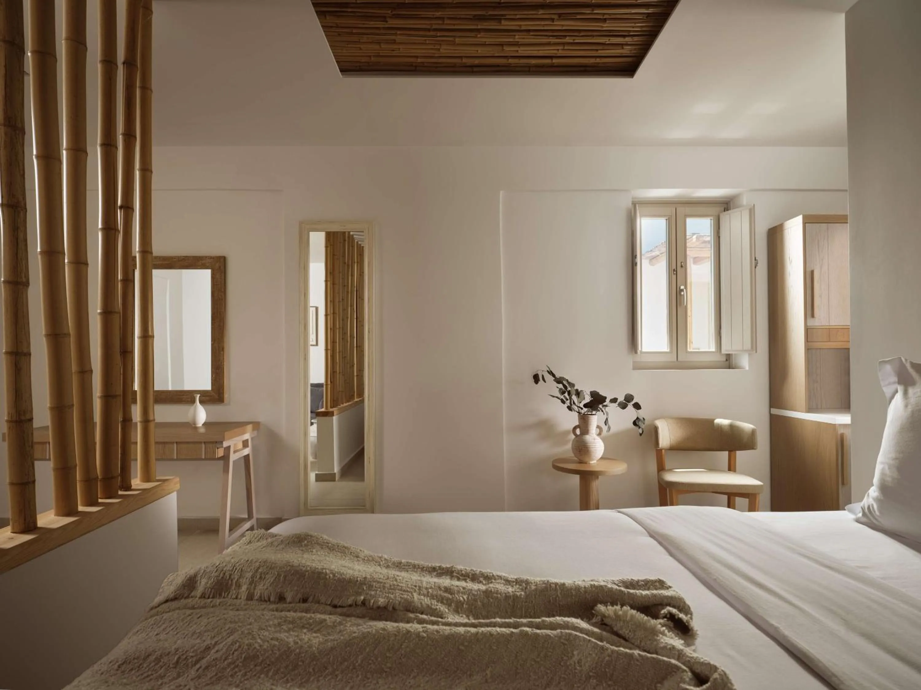 Bed in Sea Breeze Santorini Beach Resort, Curio By Hilton